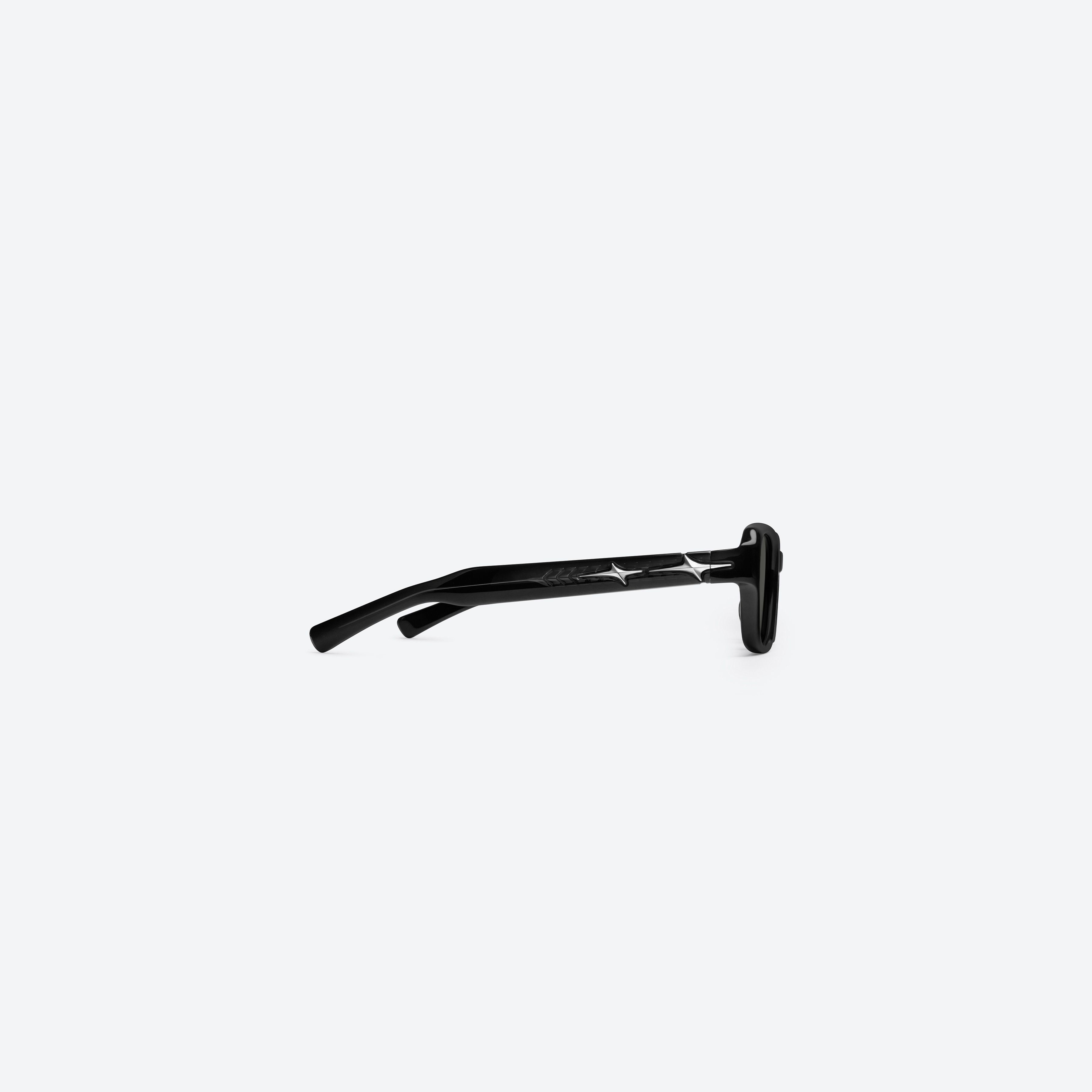 A detailed right view of Gentle Monster Comte 01(G) Black Acetate framed Square glasses.