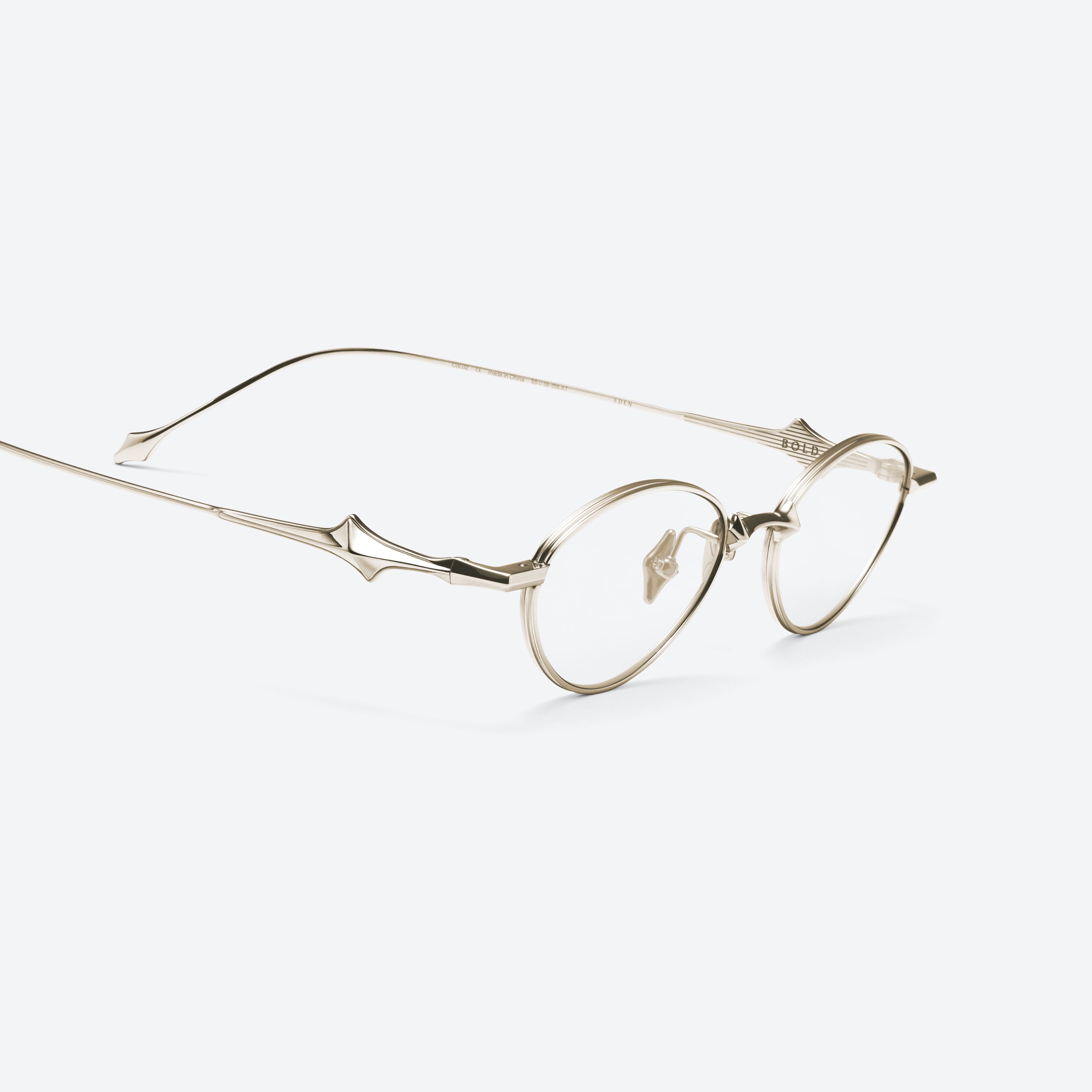 45-degree detailed view of Gentle Monster Eden 037 Gold Metal framed Oval glasses.