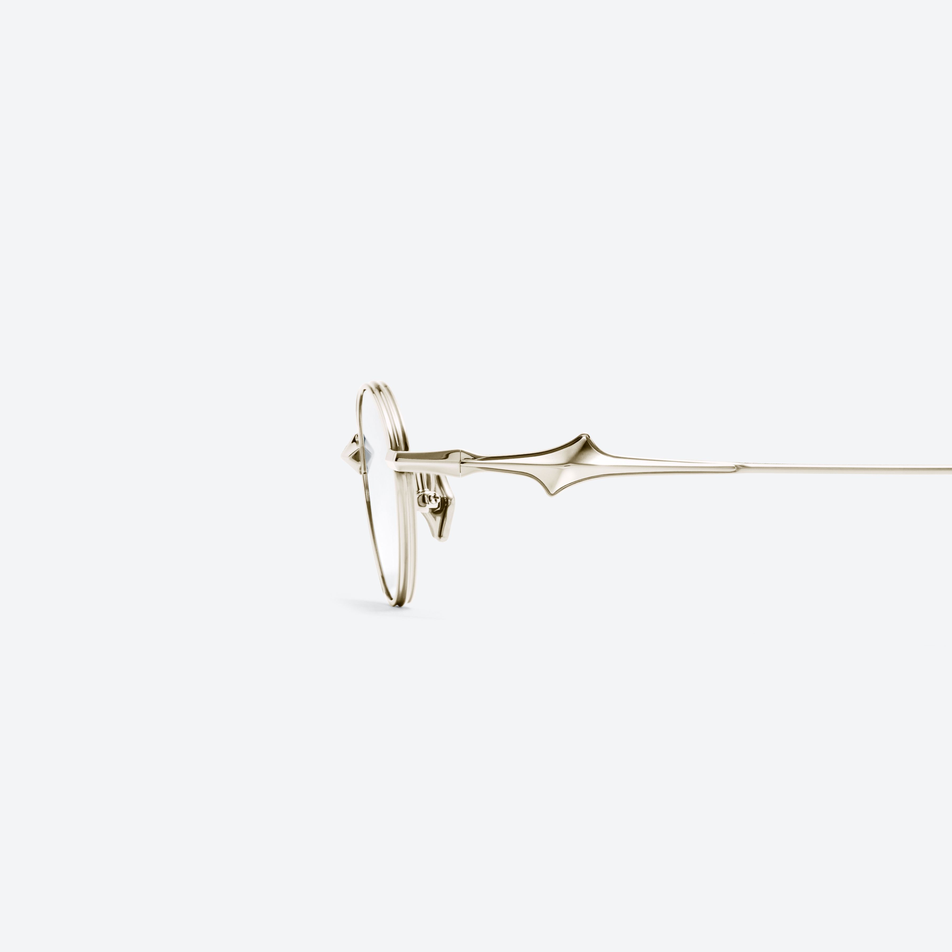 A detailed left view of Gentle Monster Eden 037 Gold Metal framed Oval glasses.