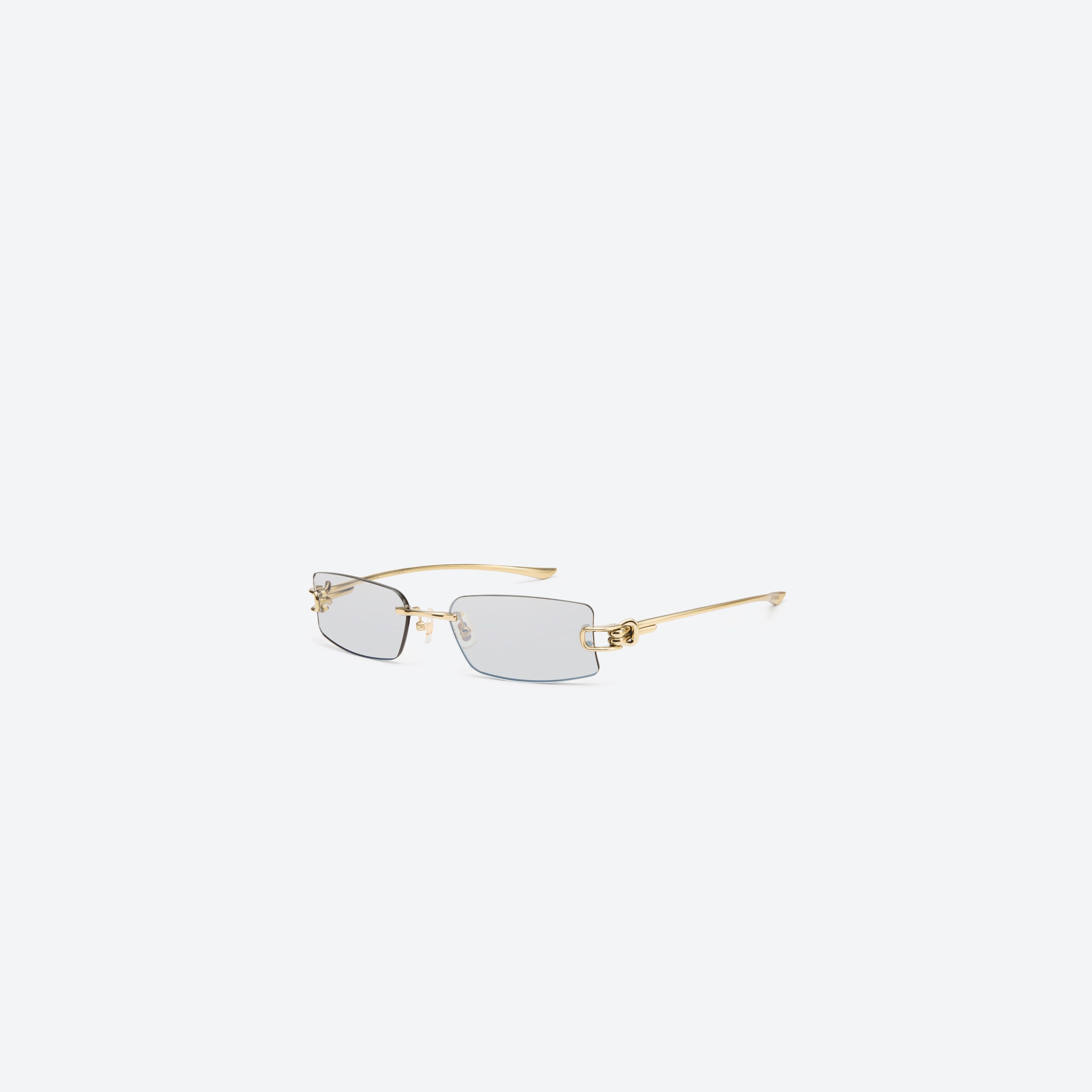 45-degree view of Gentle Monster Gamot 030 Gold Metal framed Square sunglasses.