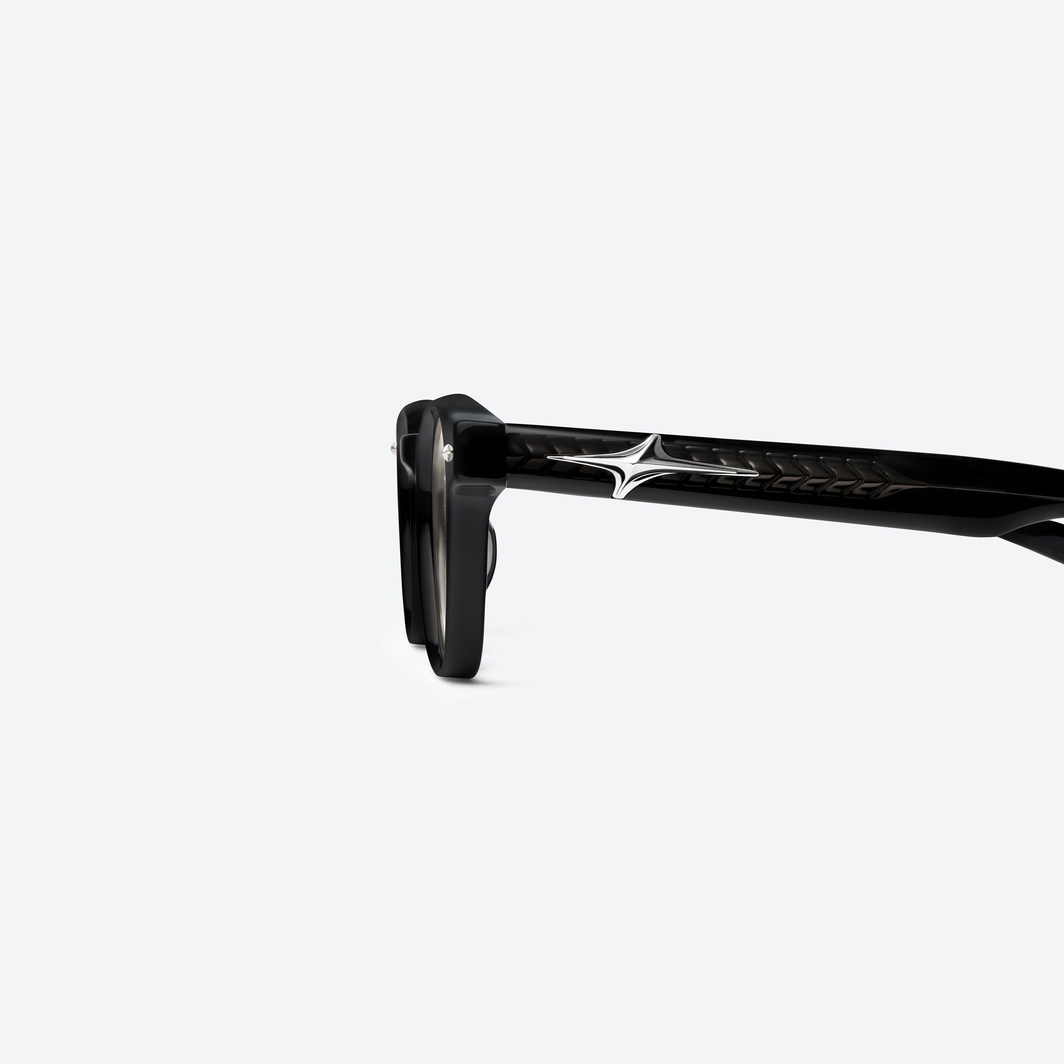 A detailed left view of Gentle Monster Joze 01(BR) Black Acetate framed Square sunglasses.