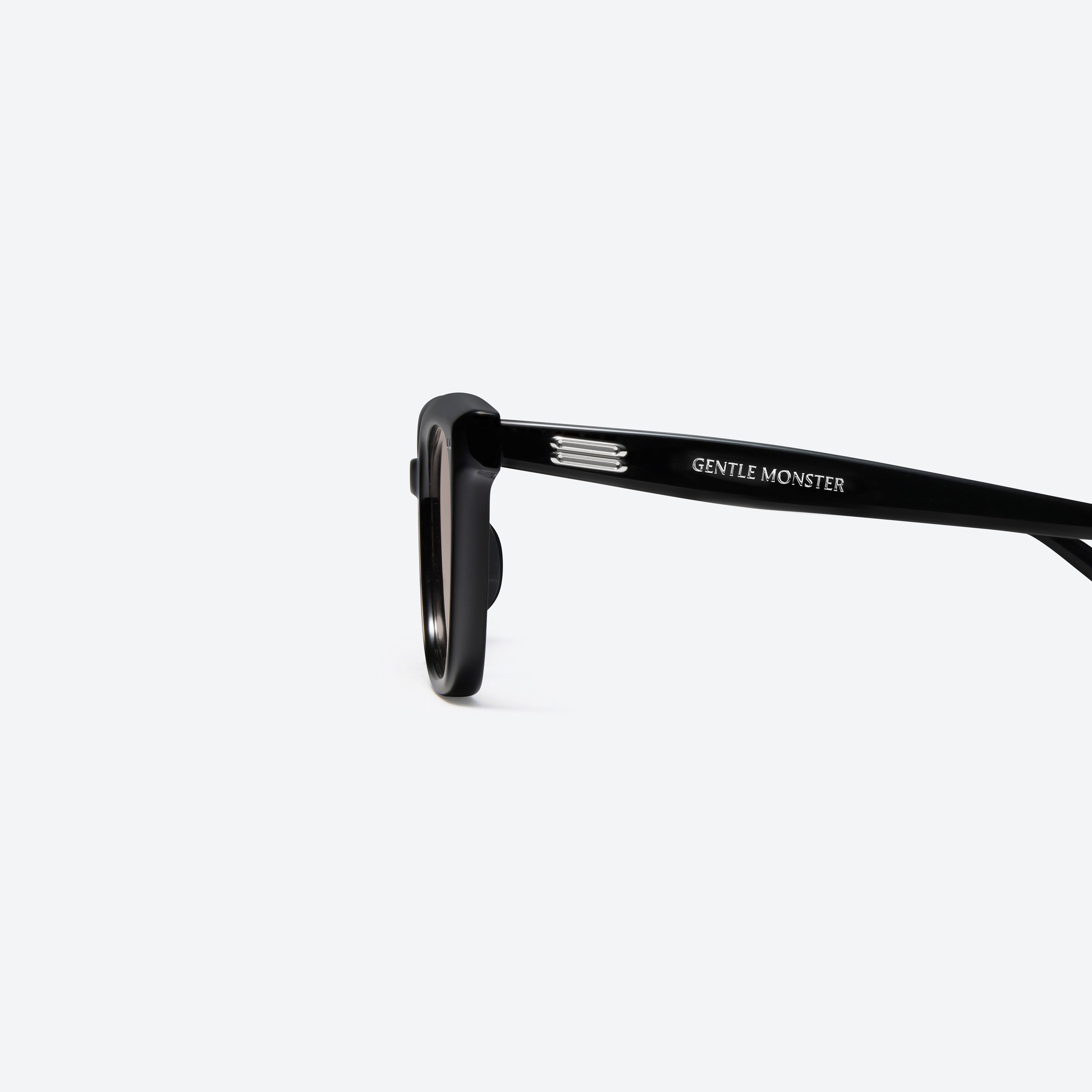 A detailed left view of Gentle Monster Soho 01(G) Black Acetate framed Square sunglasses.