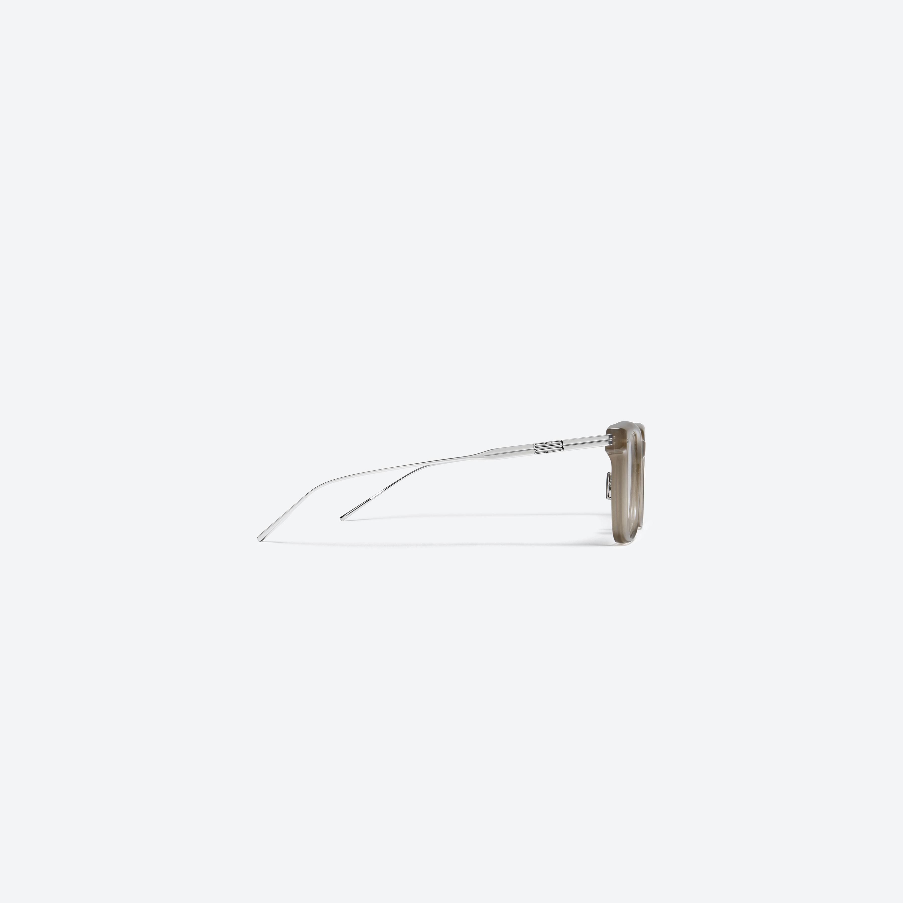 A detailed right view of Gentle Monster Zin BRC9 Brown Mixed framed Square glasses.