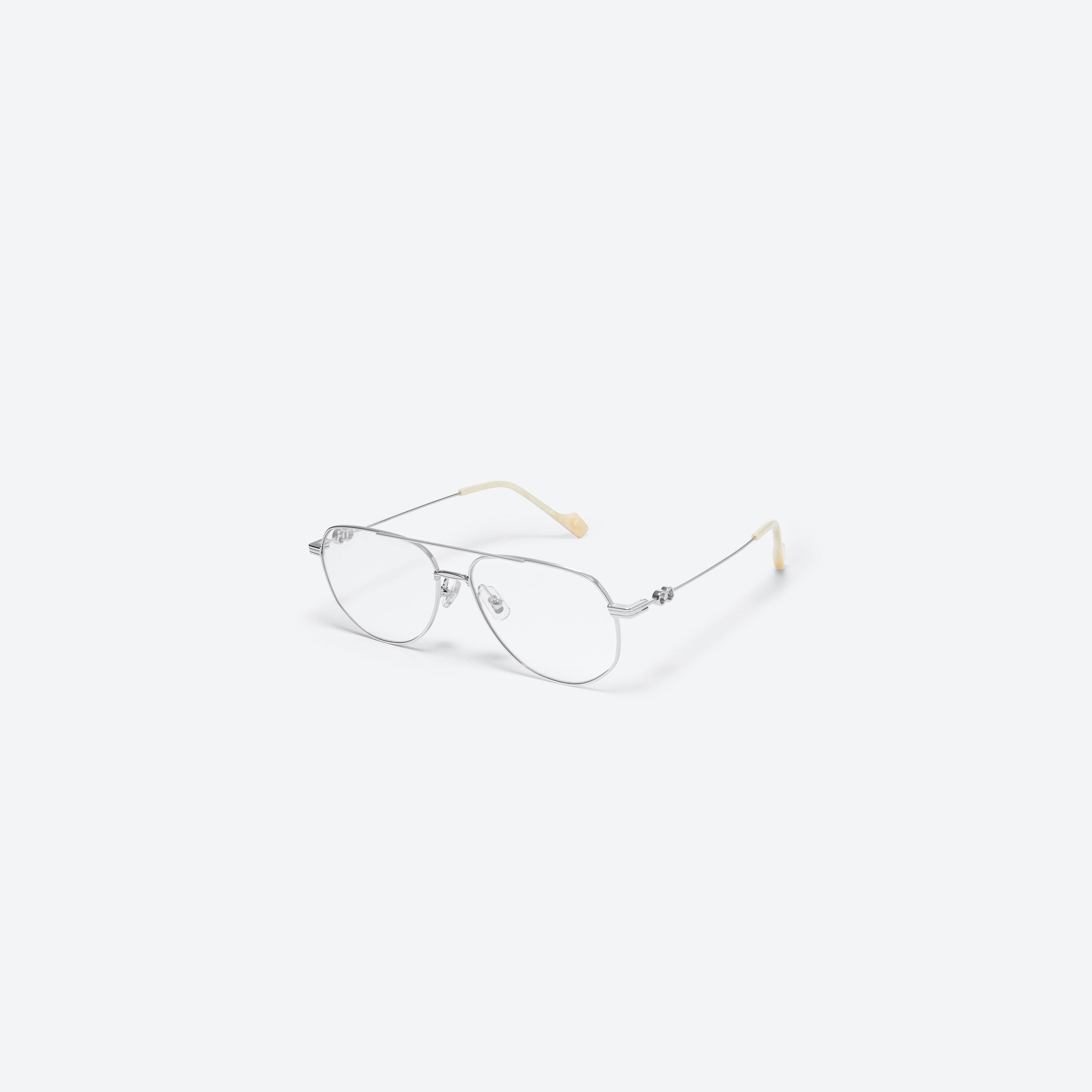 45-degree view of Gentle Monster Jennie - 26 02 Silver Metal framed Aviator glasses.