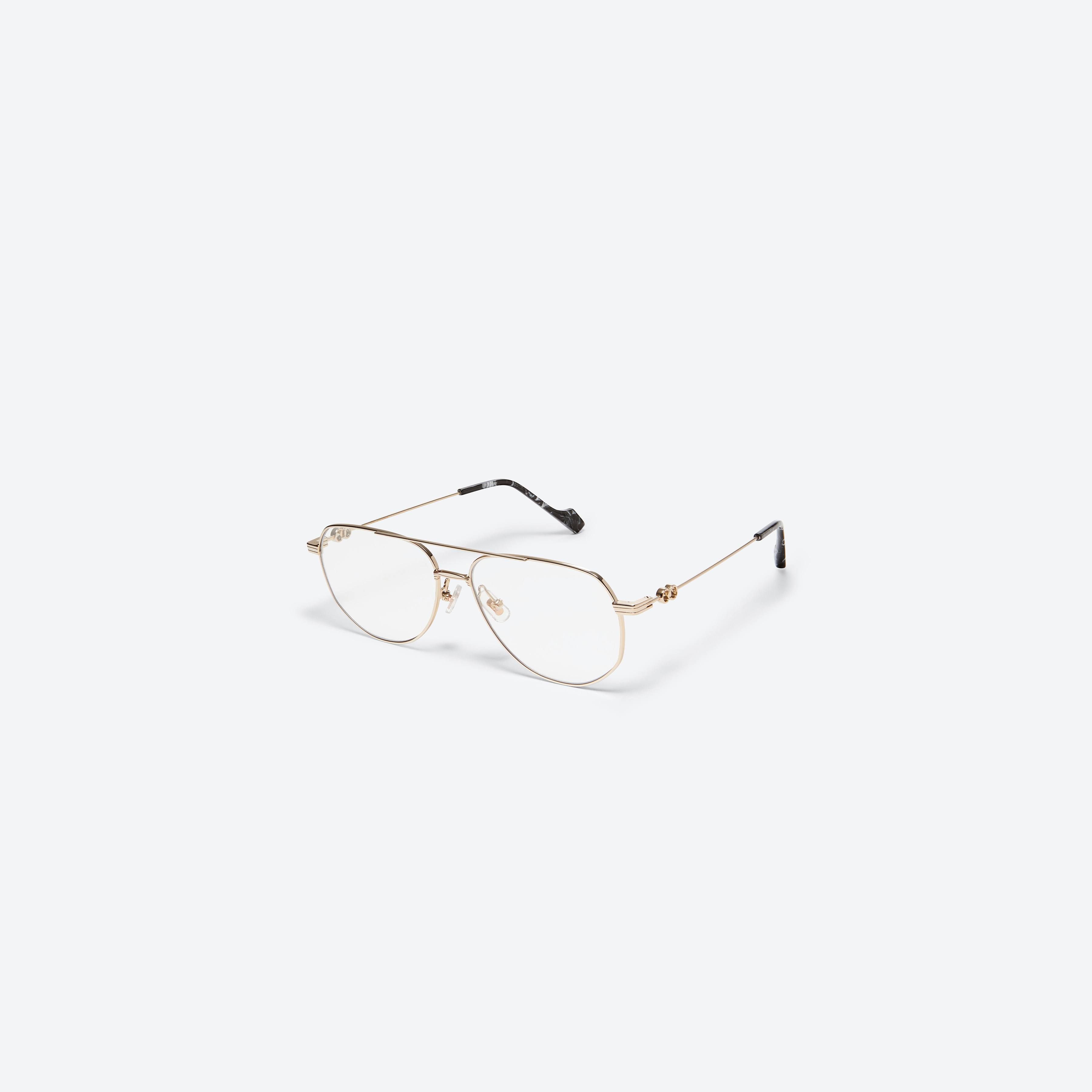 45-degree view of Gentle Monster Jennie - 26 031 Gold Metal framed Aviator glasses.