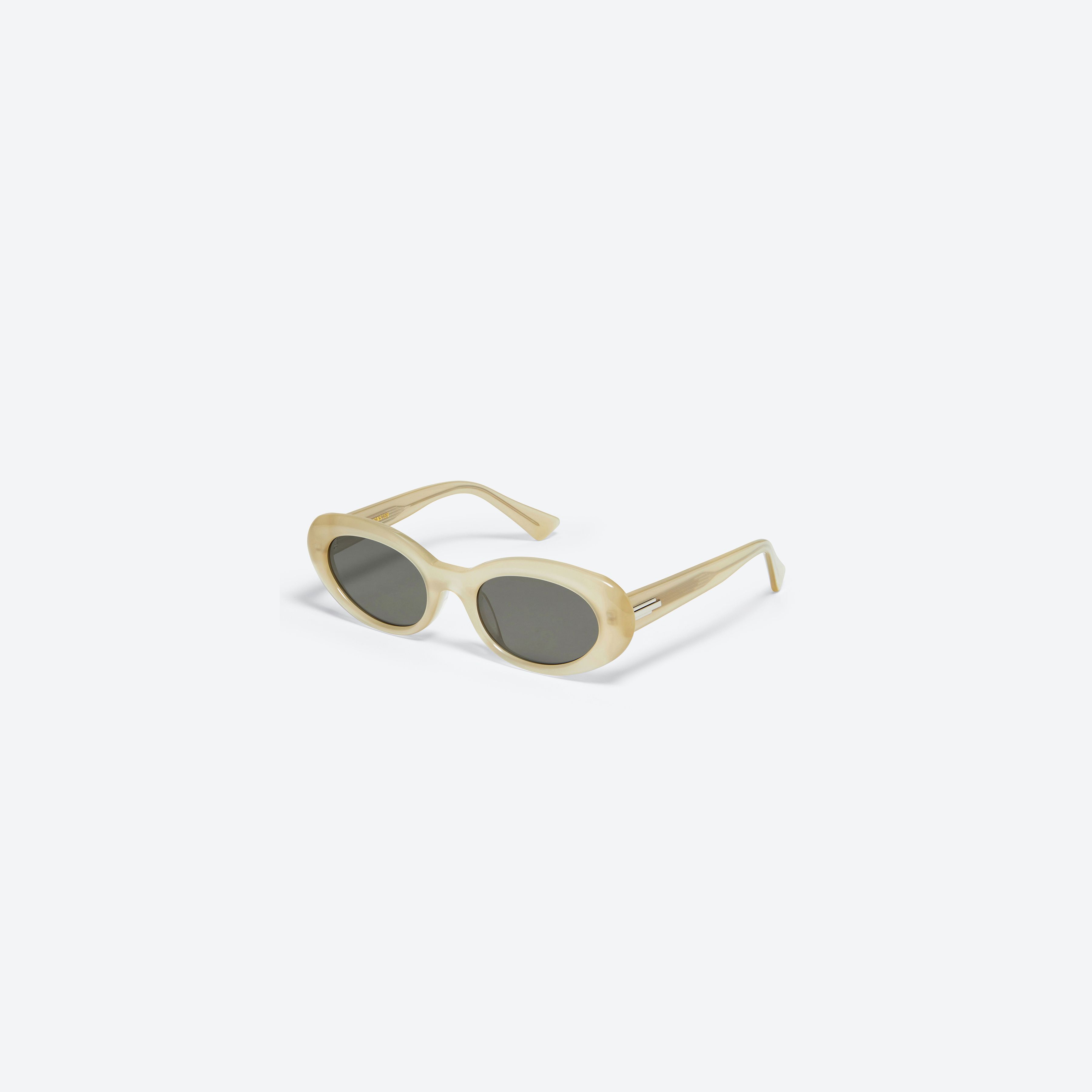 45-degree view of Gentle Monster Le IC1 Ivory Acetate framed Oval sunglasses.
