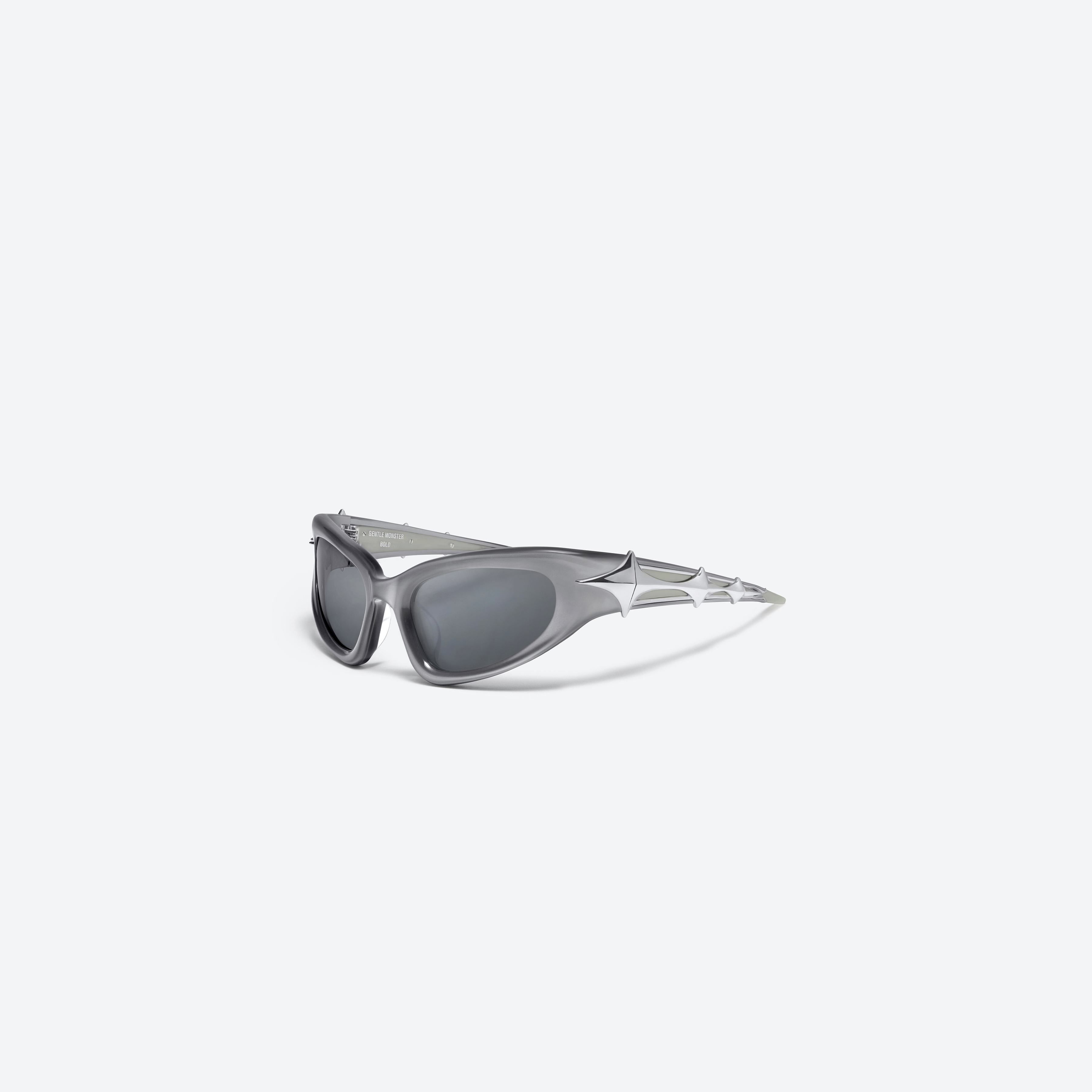 45-degree view of Gentle Monster Paso G4 Similar Gray Acetate framed Wraparound sunglasses.