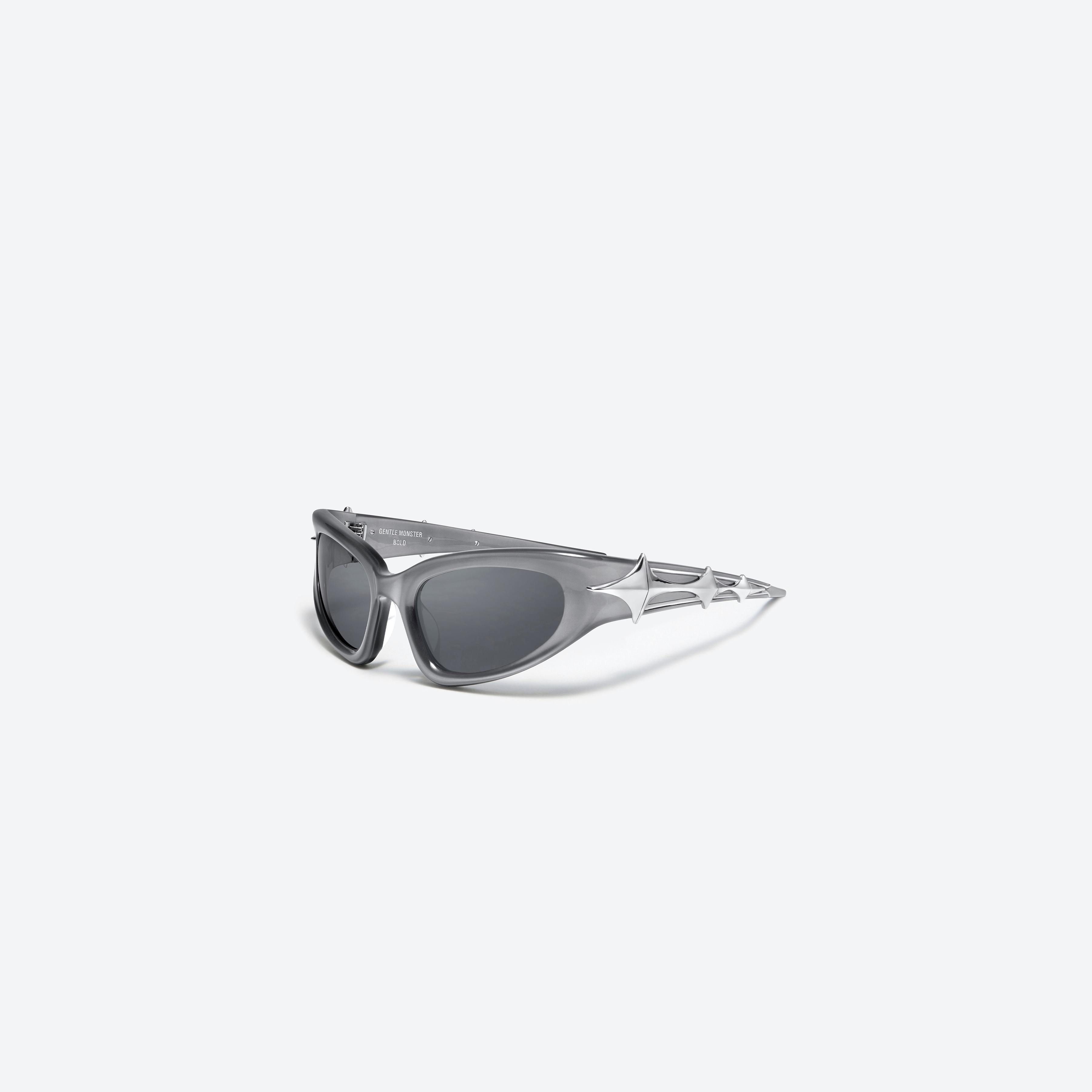 45-degree view of Gentle Monster Paso G4(1M) Gray Acetate framed Wraparound sunglasses.
