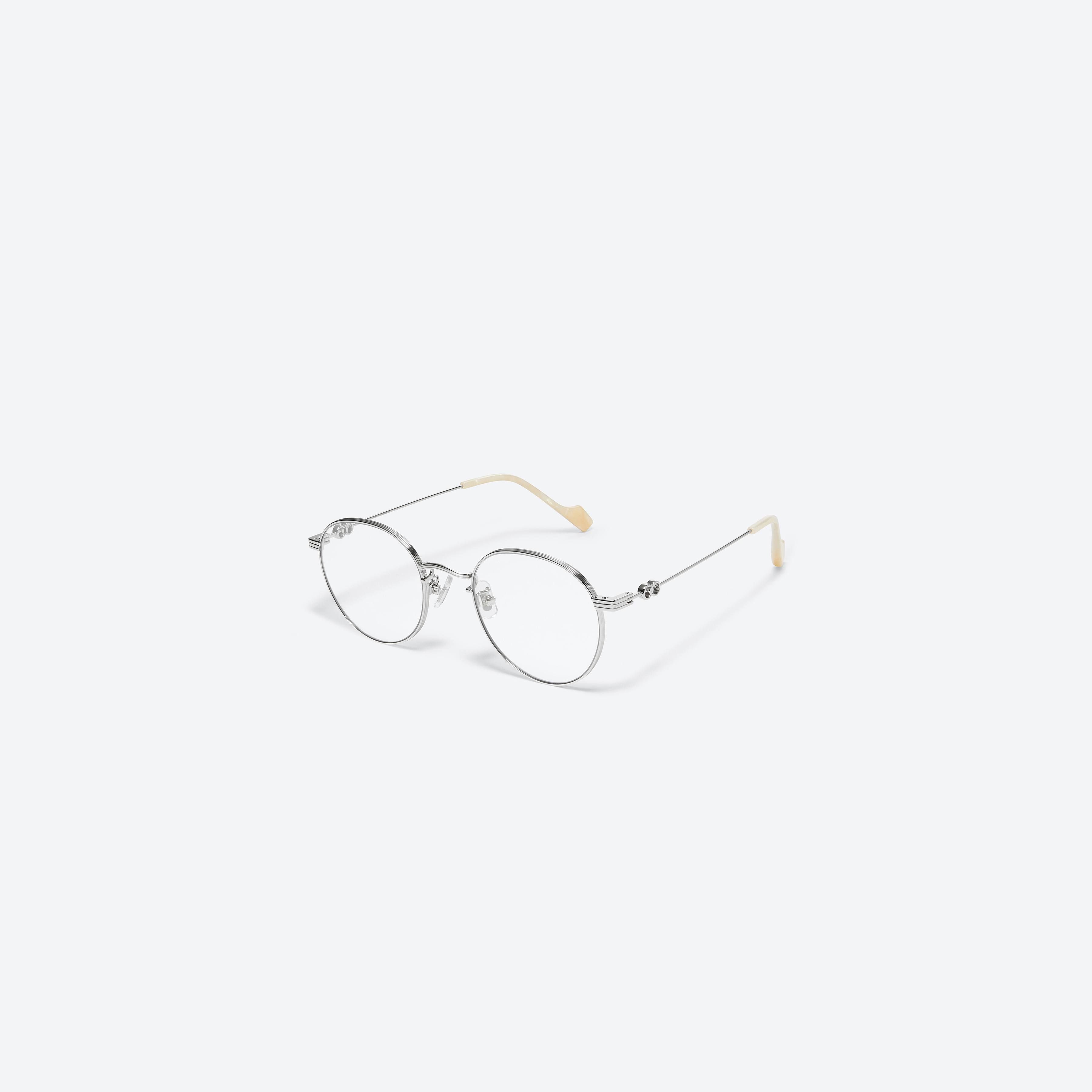 45-degree view of Gentle Monster Jennie - Cloudy Day Only 02 Silver Metal framed Round glasses.