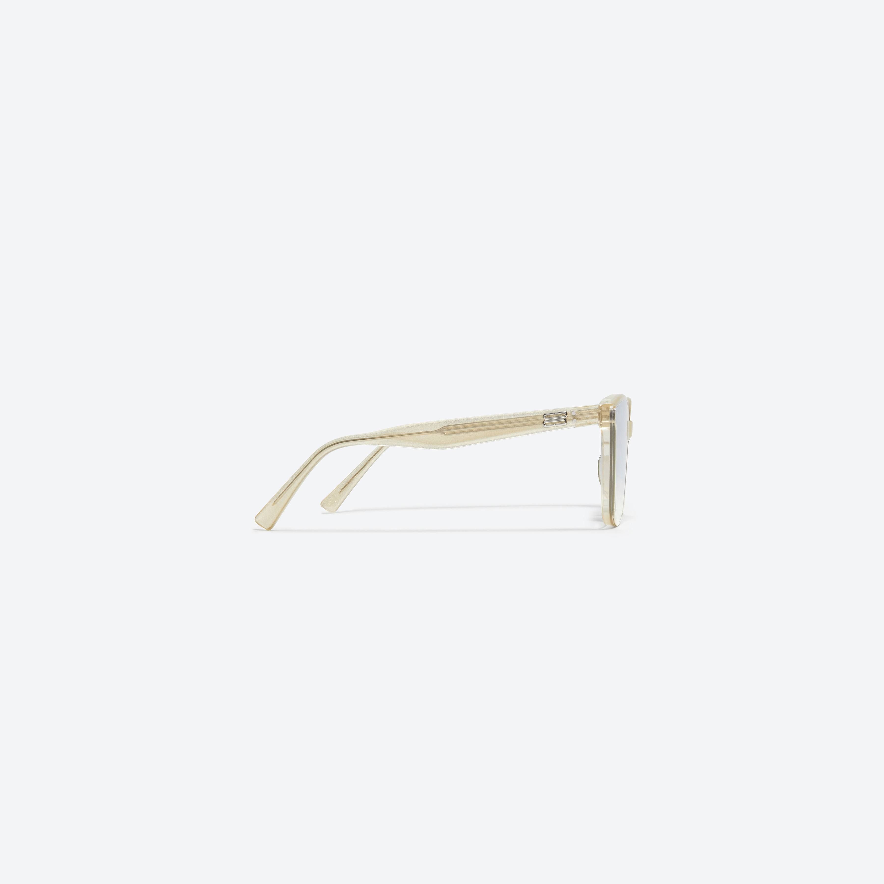 A detailed right view of Gentle Monster Queen GDC1 Gold Acetate framed Square sunglasses.