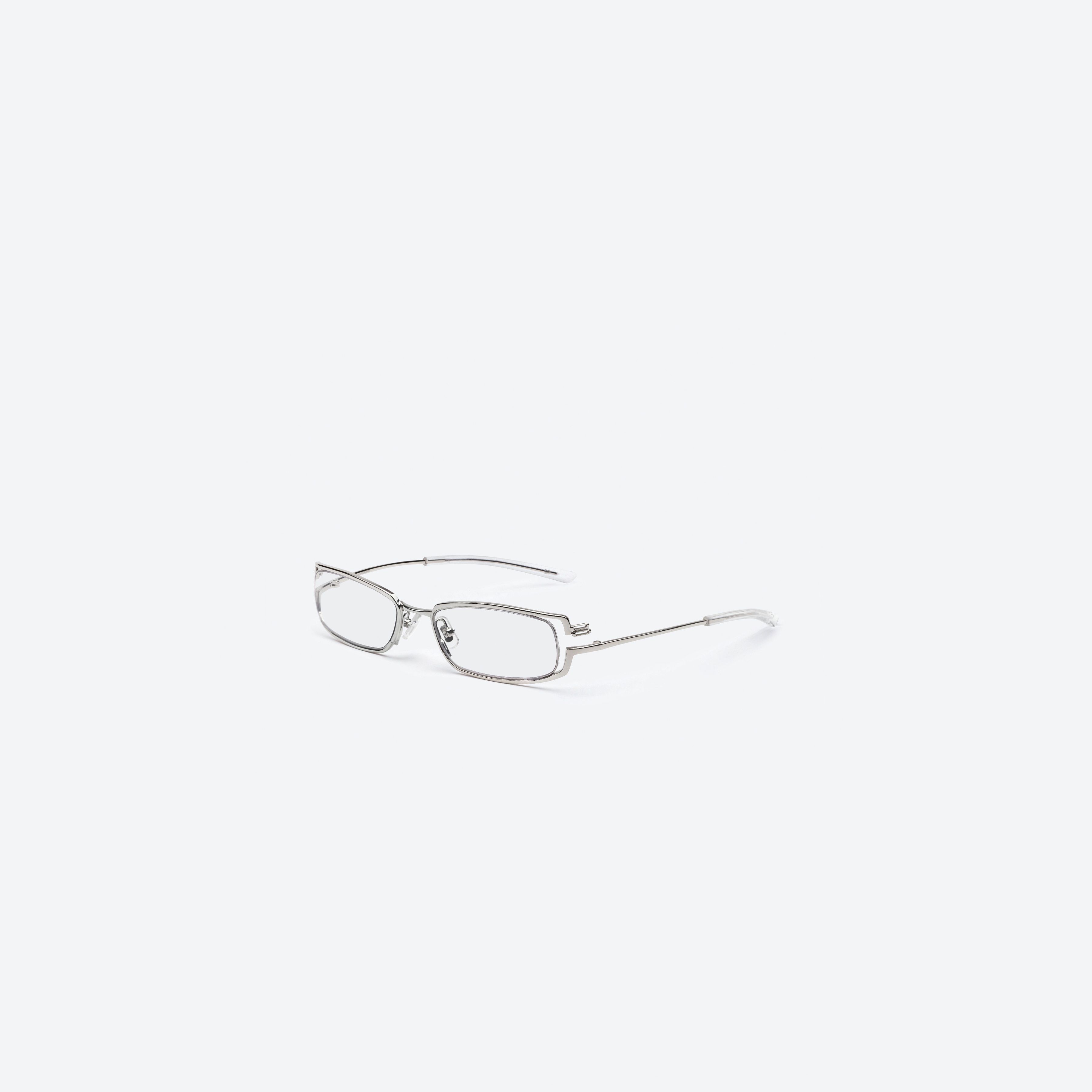 45-degree view of Gentle Monster Epic 02 Silver Metal framed Square glasses.