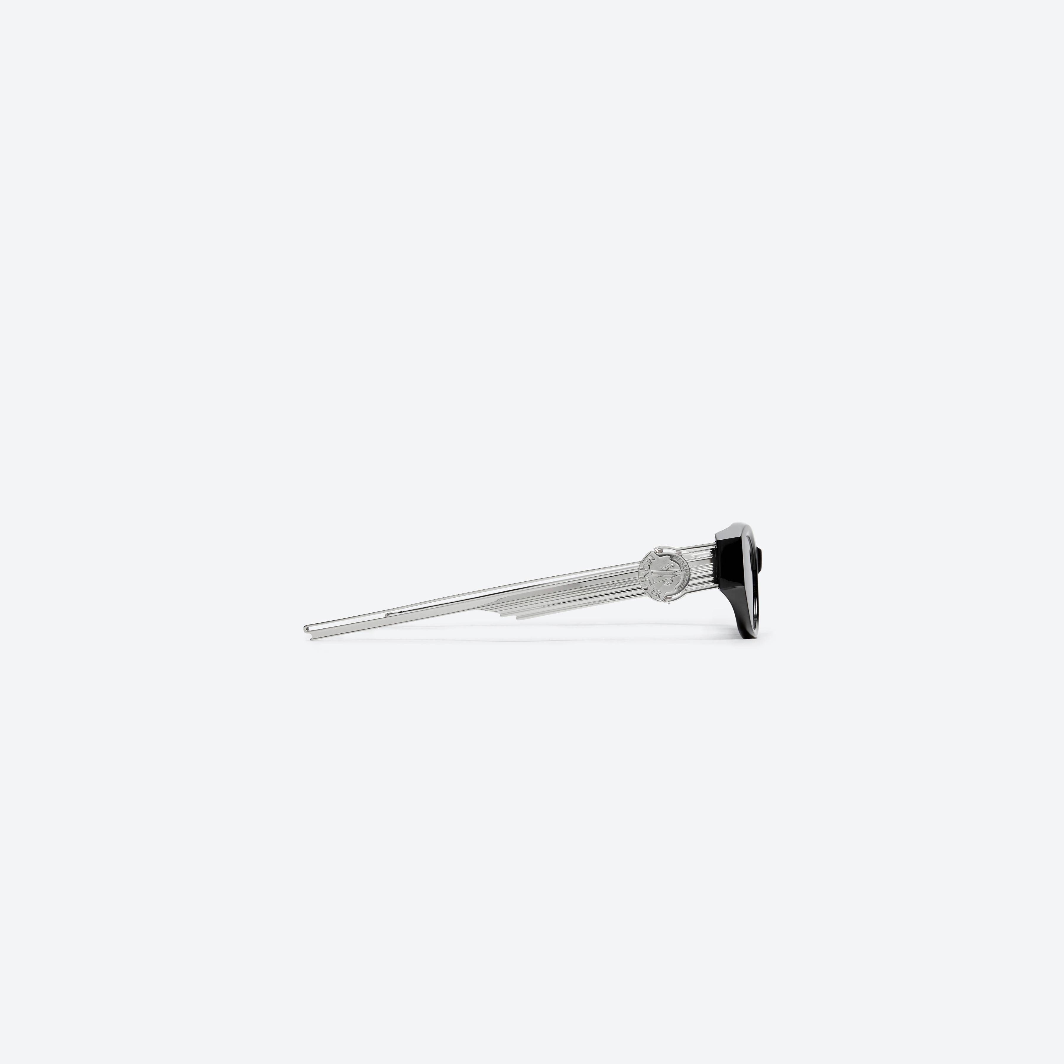 A detailed right view of Gentle Monster Moncler - Swipe 2 01 Black Mixed framed Cat-eye sunglasses.
