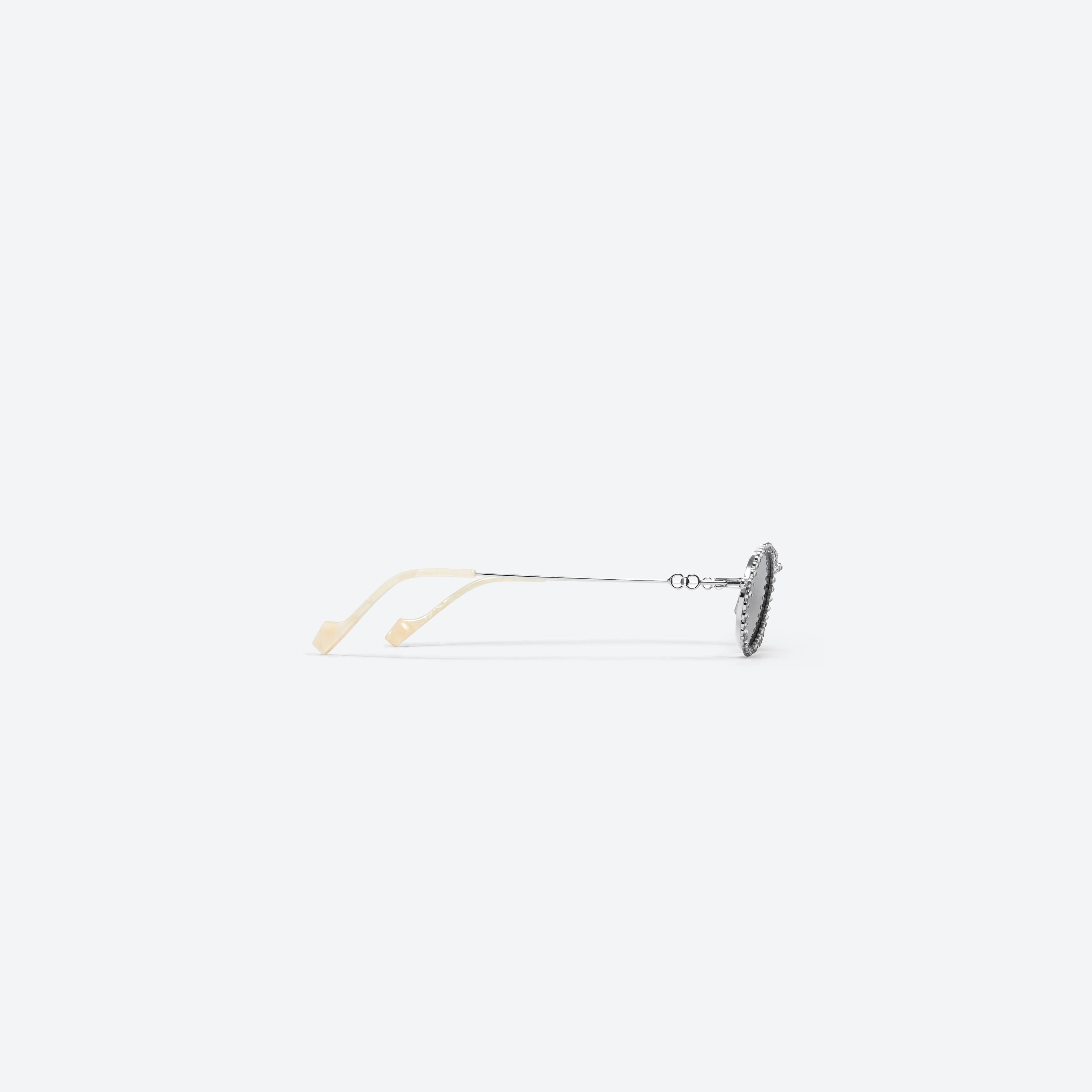 A detailed right view of Gentle Monster Jennie - Lesyeuxdenini 02 Silver Metal framed Oval sunglasses.