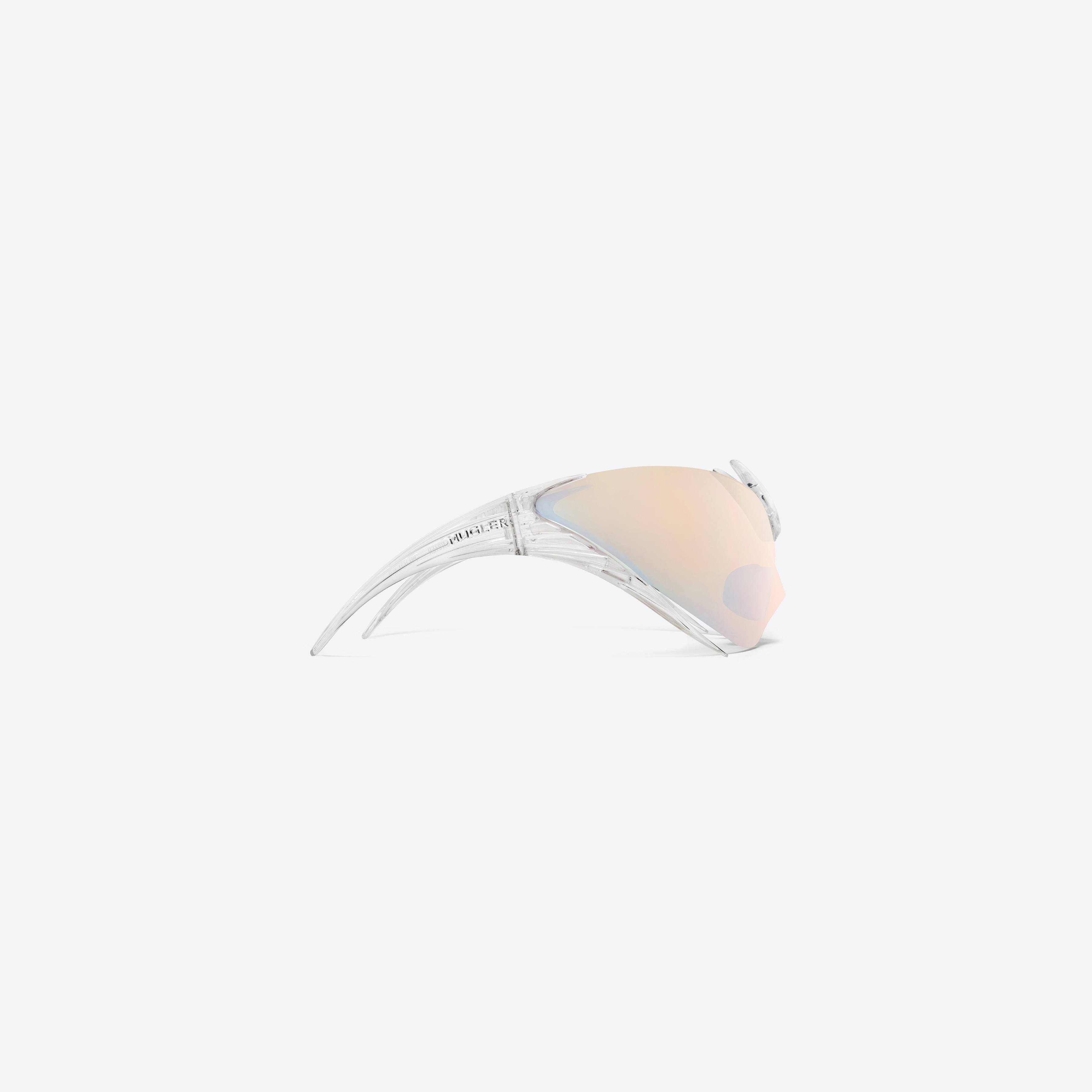 A detailed right view of Gentle Monster Mugler - Spiral 01 C1 Clear Nylon framed Wraparound sunglasses.