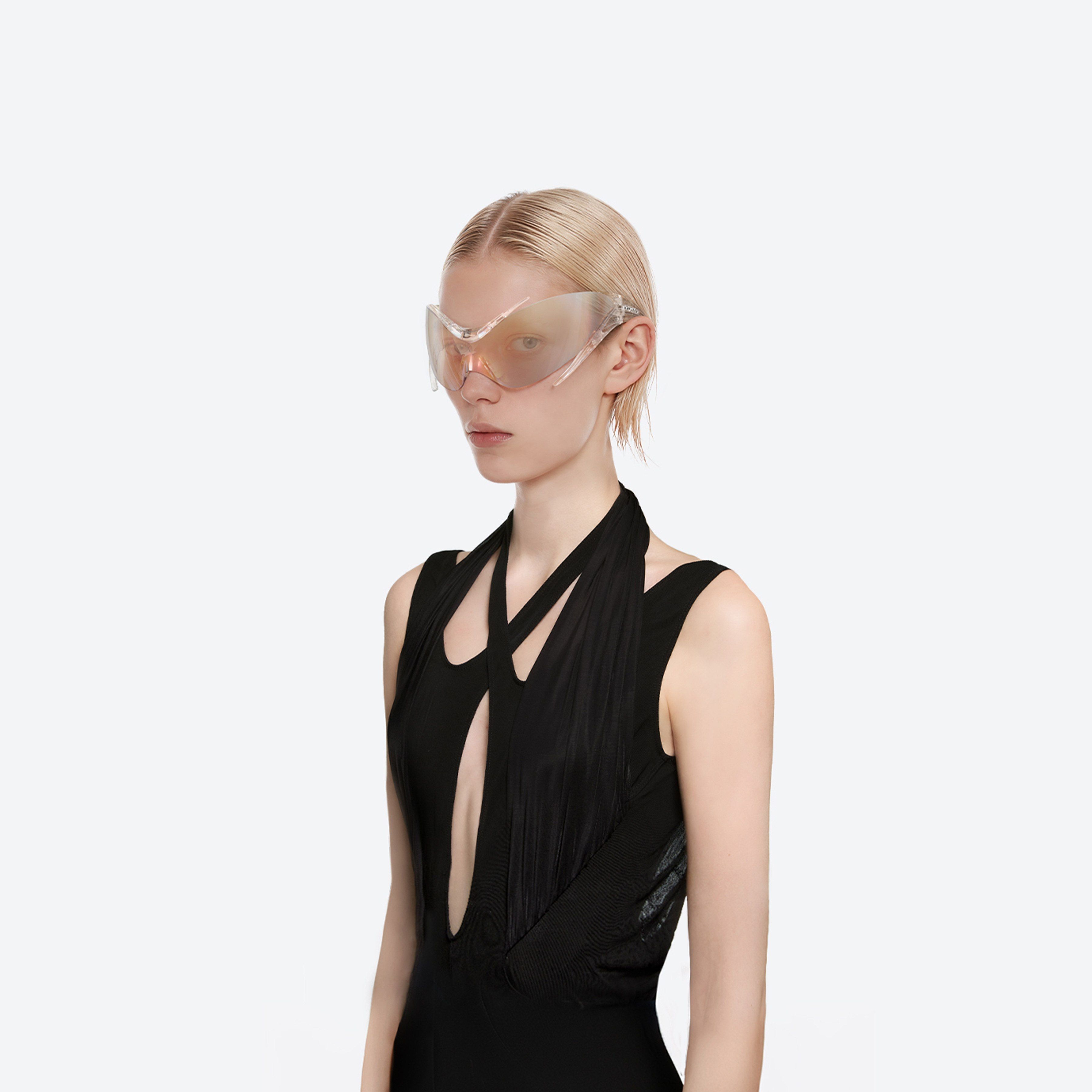 Model wearing the Mugler - Spiral 01 C1 Clear Nylon framed Wraparound sunglasses.