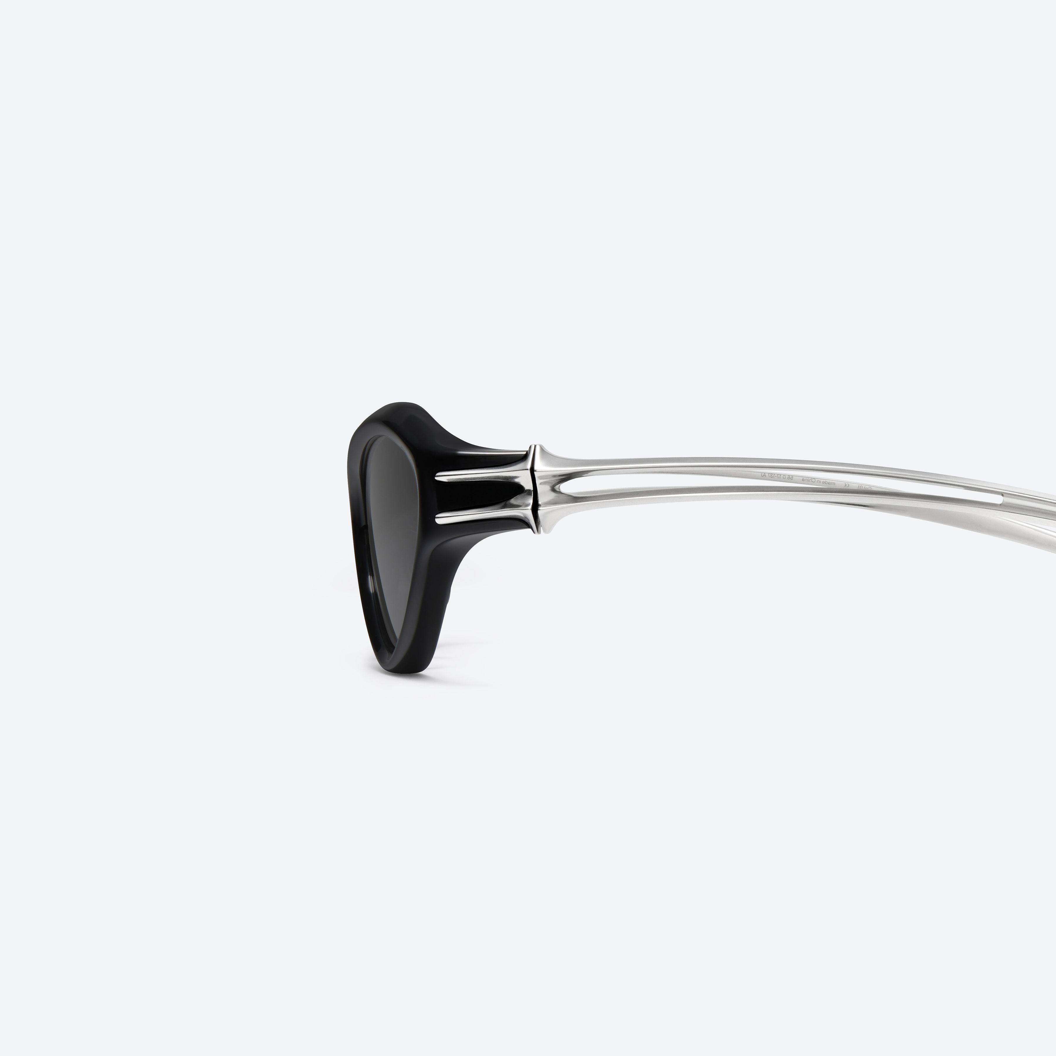 A detailed left view of Gentle Monster Sequence 01 Black Mixed framed Wraparound sunglasses.