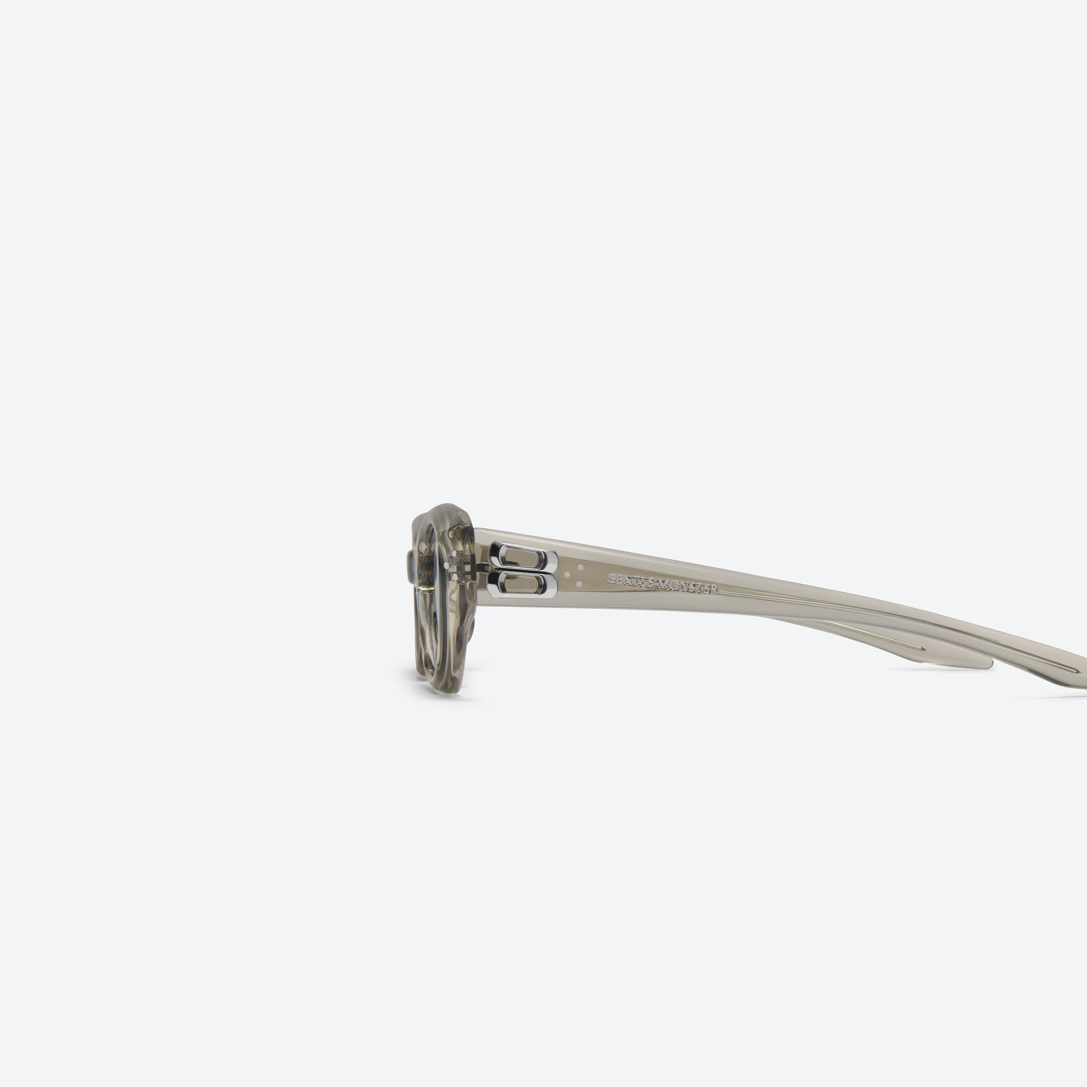 A detailed left view of Gentle Monster DUNS BRC11 Brown Acetate framed Oval sunglasses.