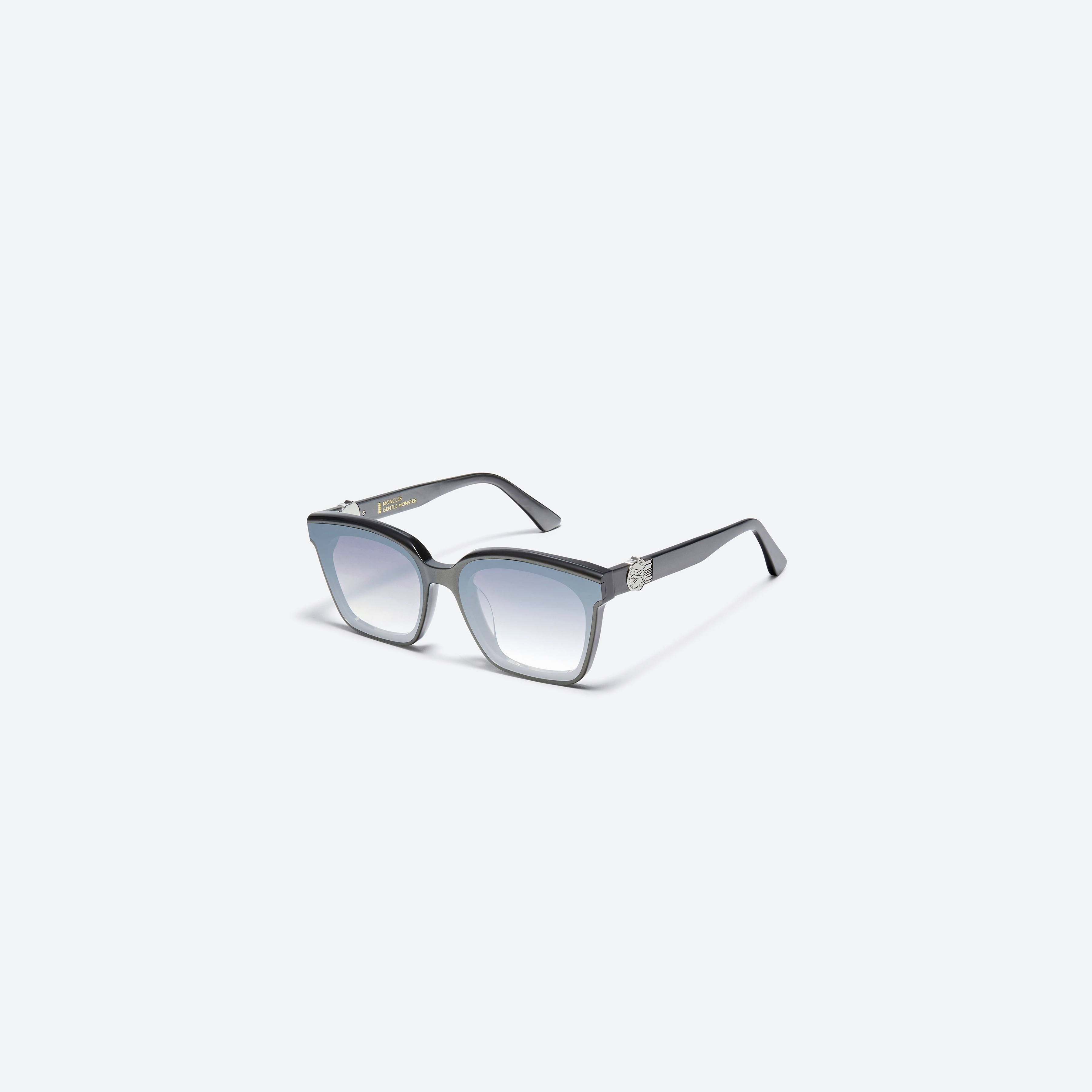 45-degree view of Gentle Monster Moncler - Swipe 3 G5 Gray Mixed framed Square sunglasses.