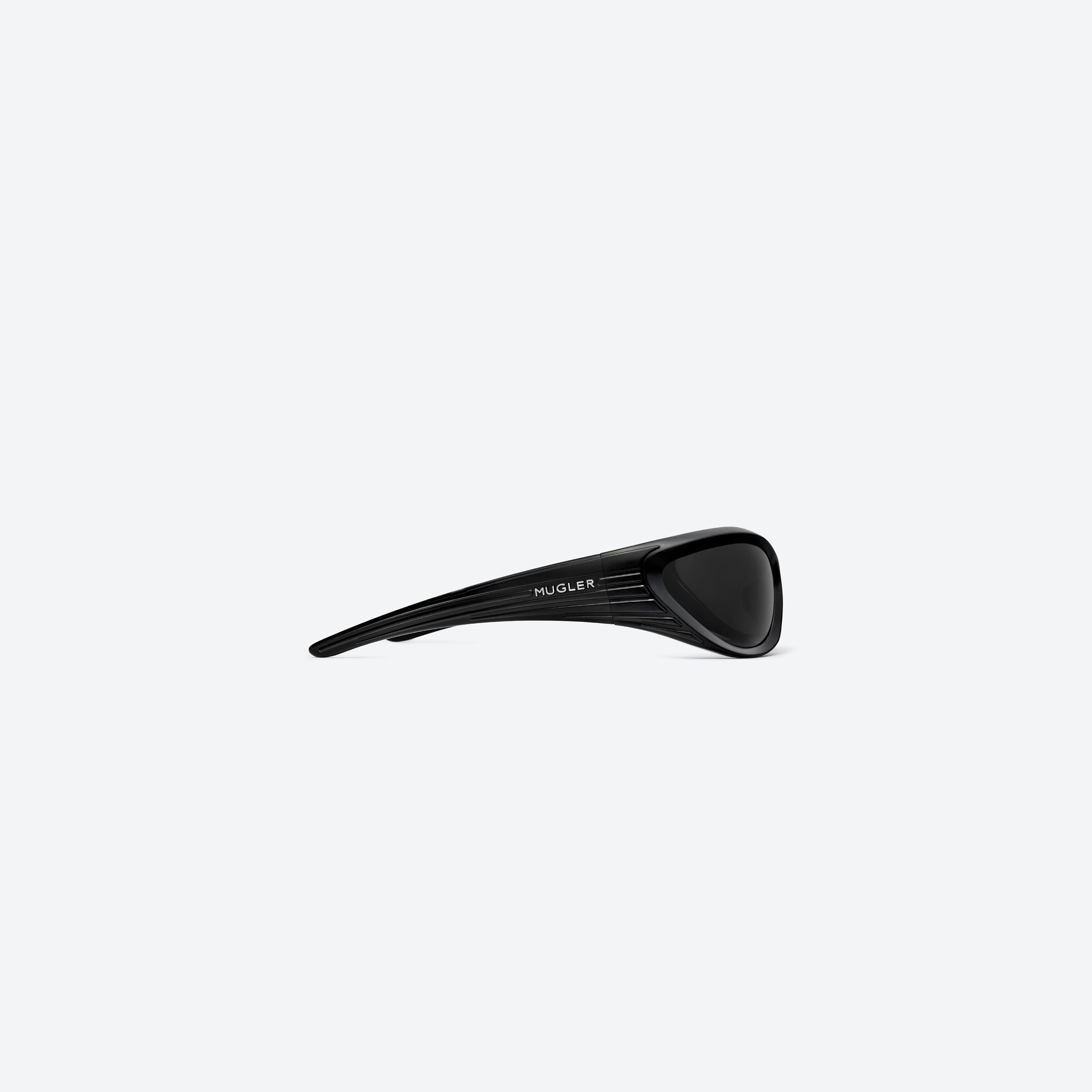 A detailed right view of Gentle Monster Mugler - Spiral 02 M01 Black Nylon framed Wraparound sunglasses.