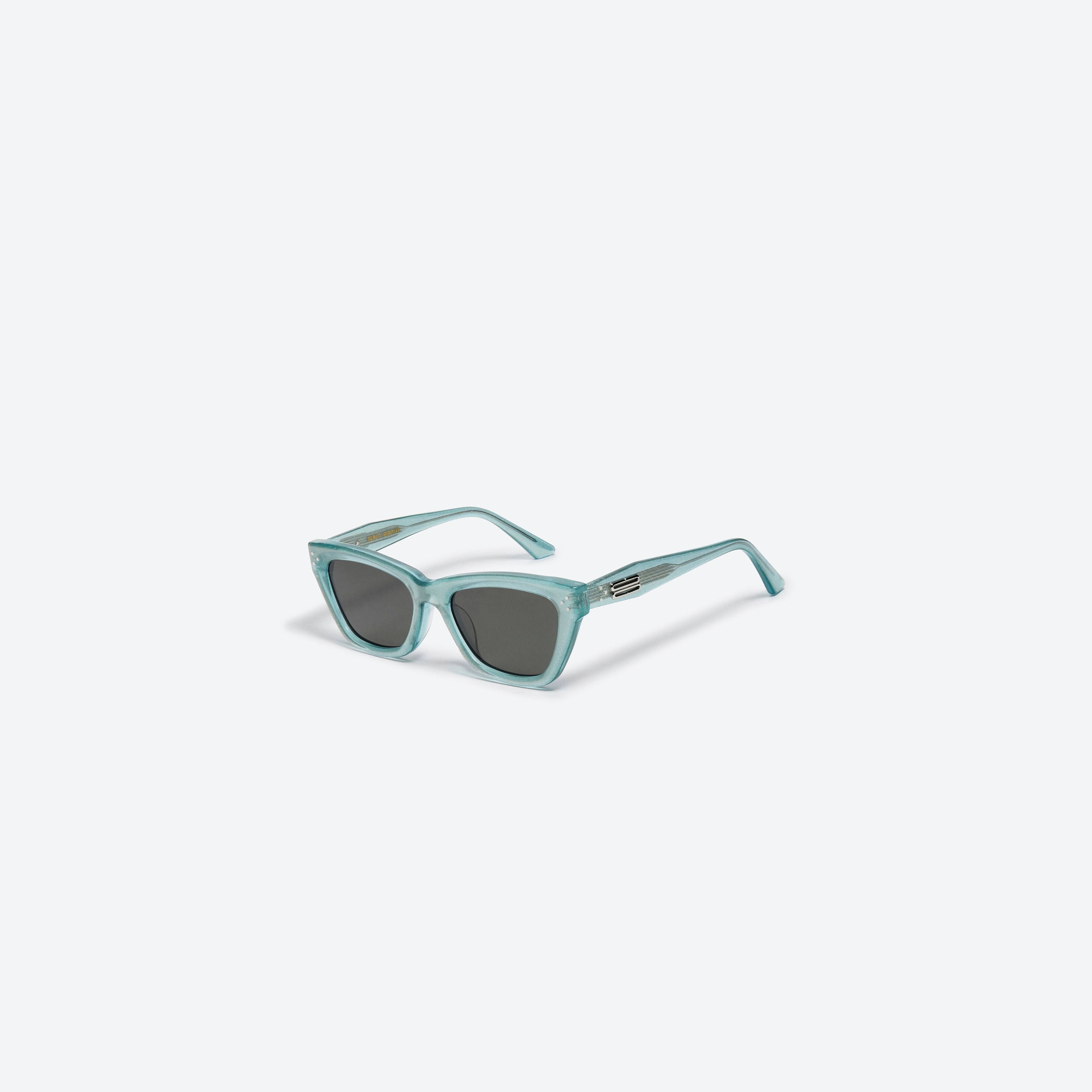 45-degree view of Gentle Monster Milo GRC4 Green Acetate framed Cat-eye sunglasses.
