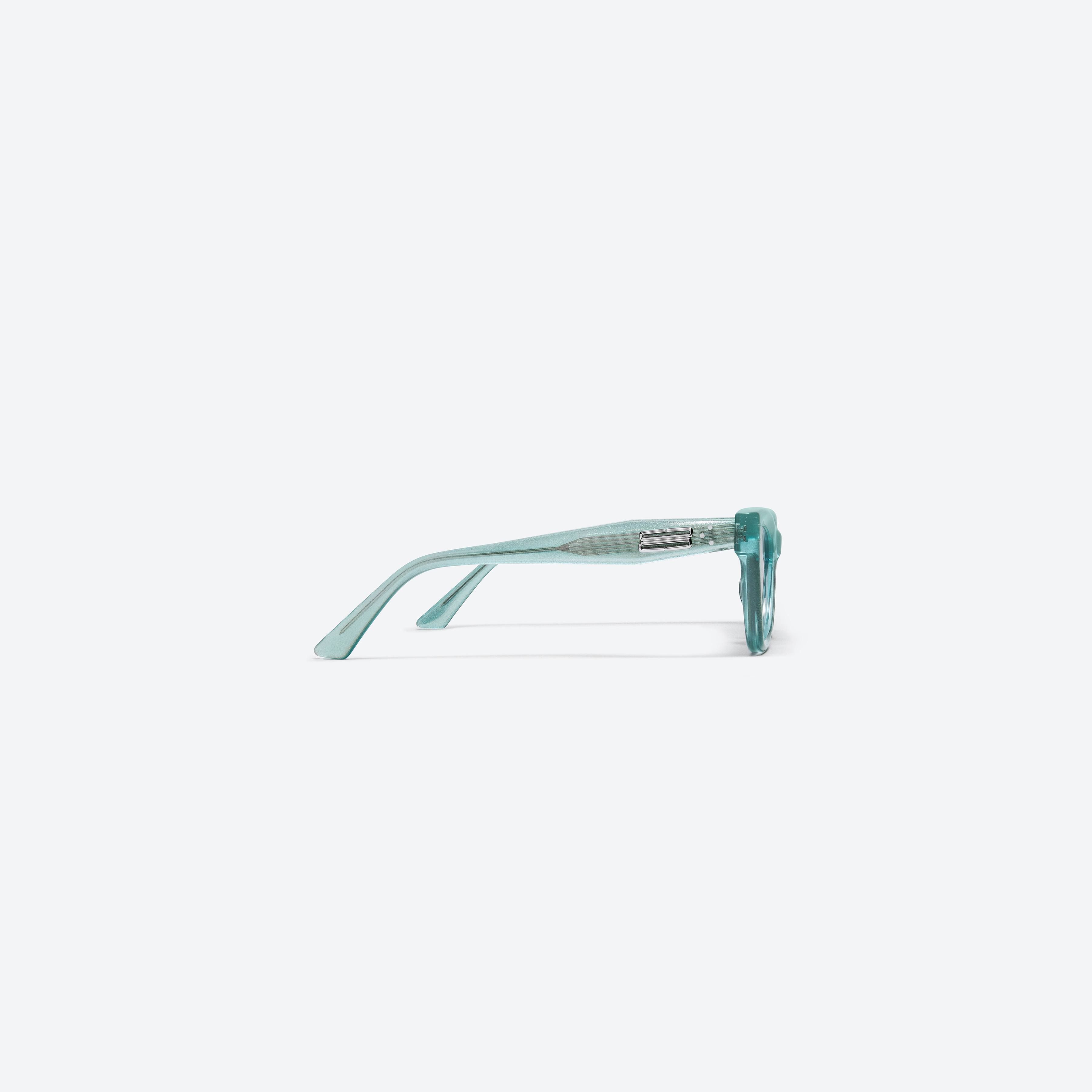 A detailed right view of Gentle Monster Milo GRC4 Green Acetate framed Cat-eye sunglasses.
