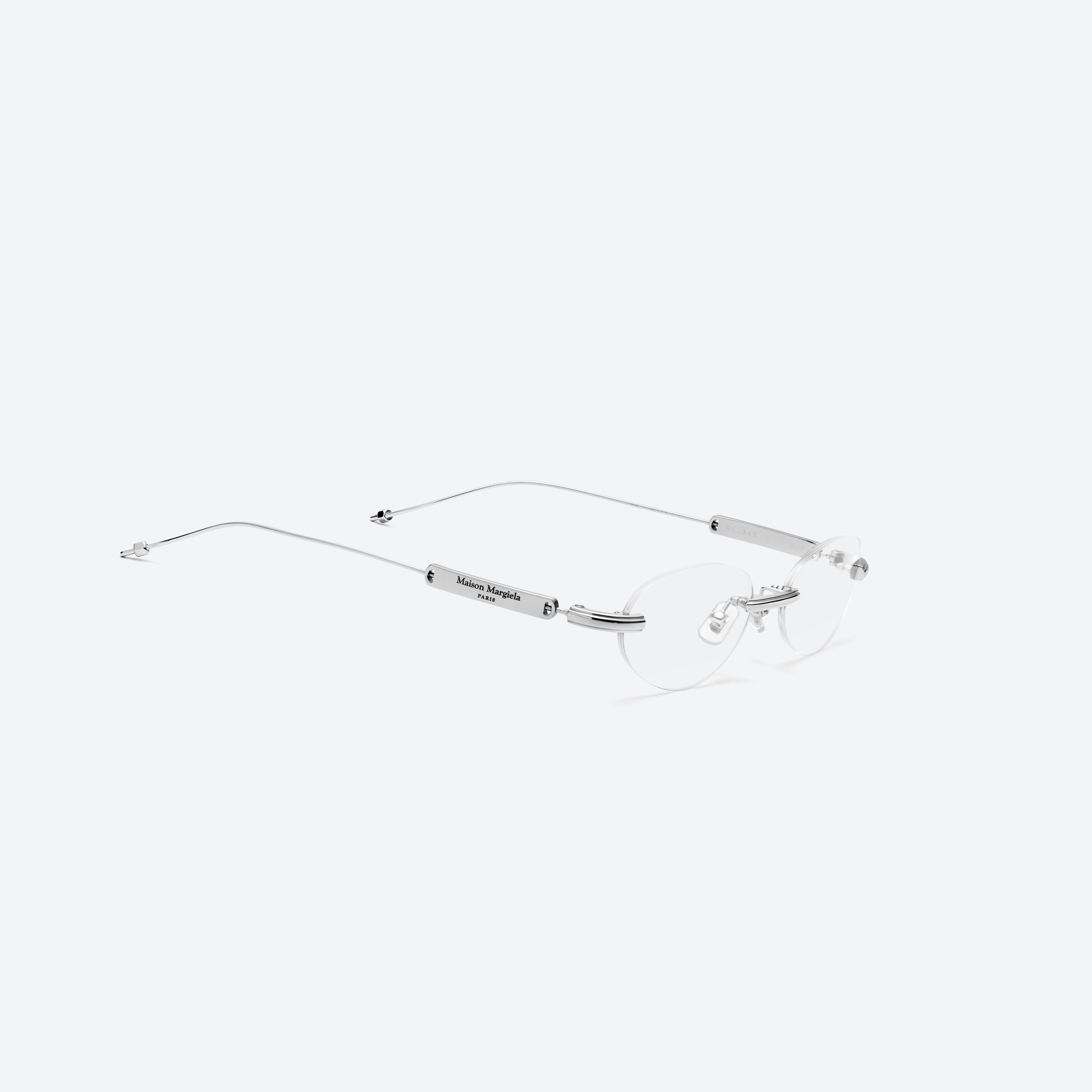 45-degree detailed view of Gentle Monster MM217 02 Silver Metal framed Oval glasses.