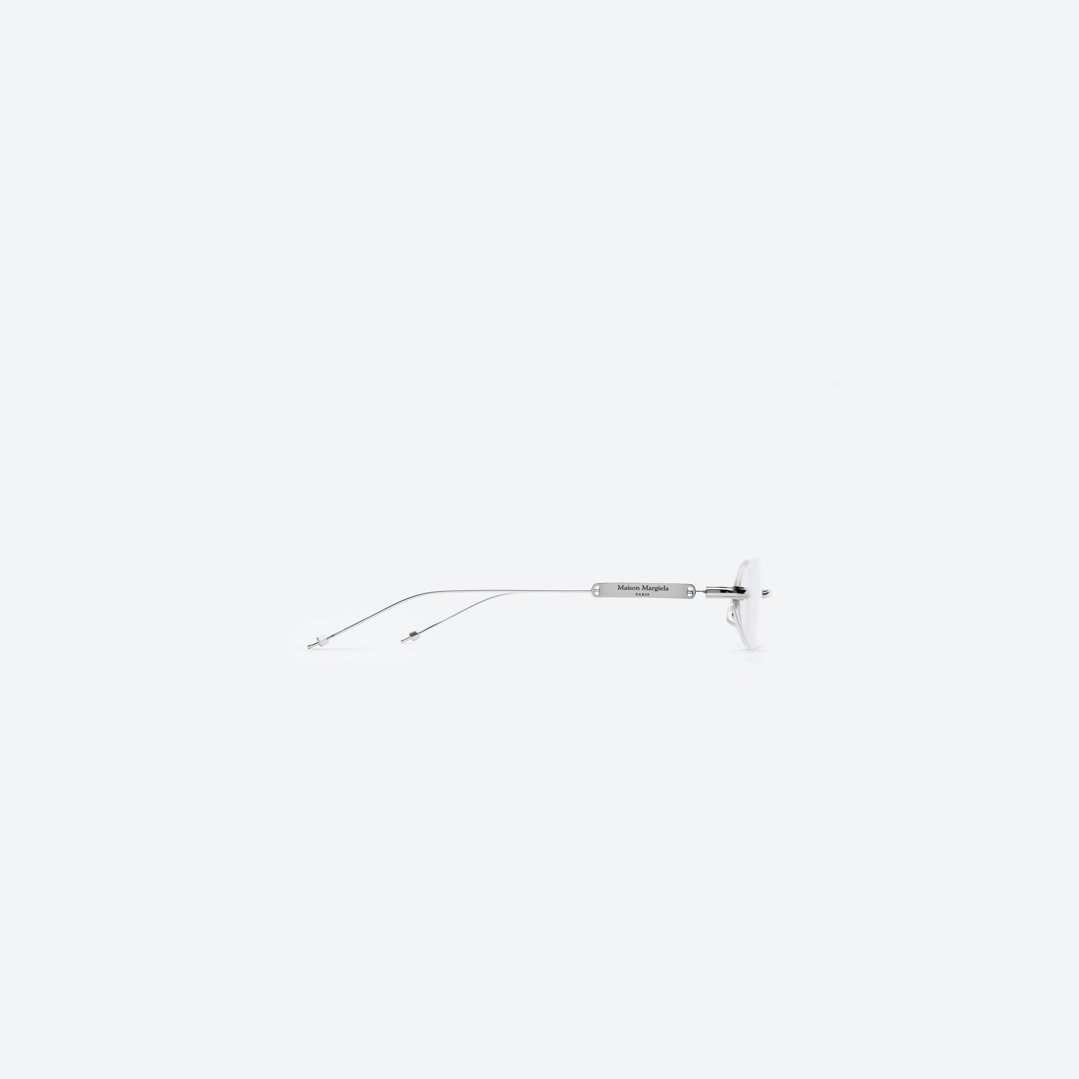 A detailed right view of Gentle Monster MM217 02 Silver Metal framed Oval glasses.