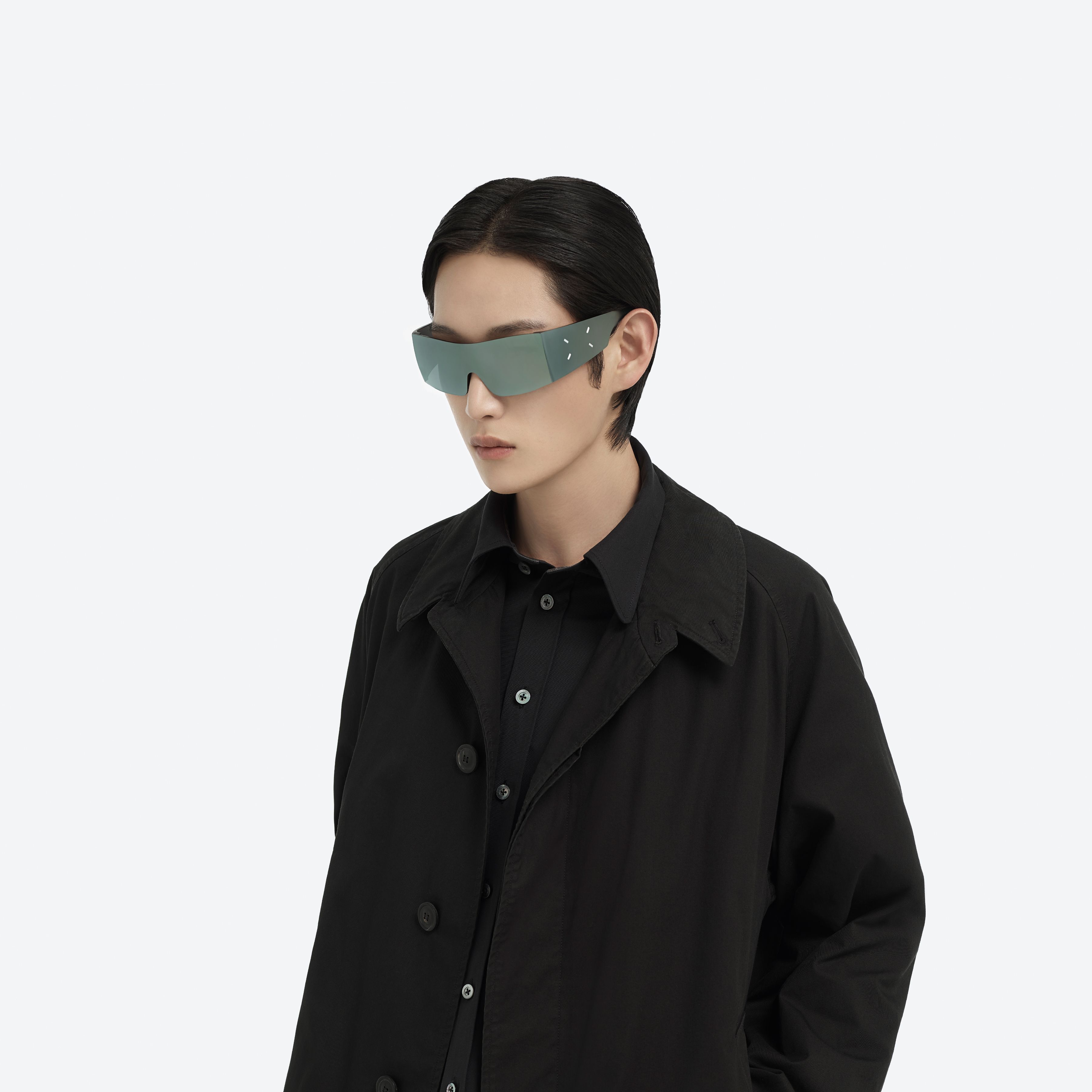Model wearing the Maison Margiela - MM201 MGR1 Green Nylon framed Wraparound sunglasses.