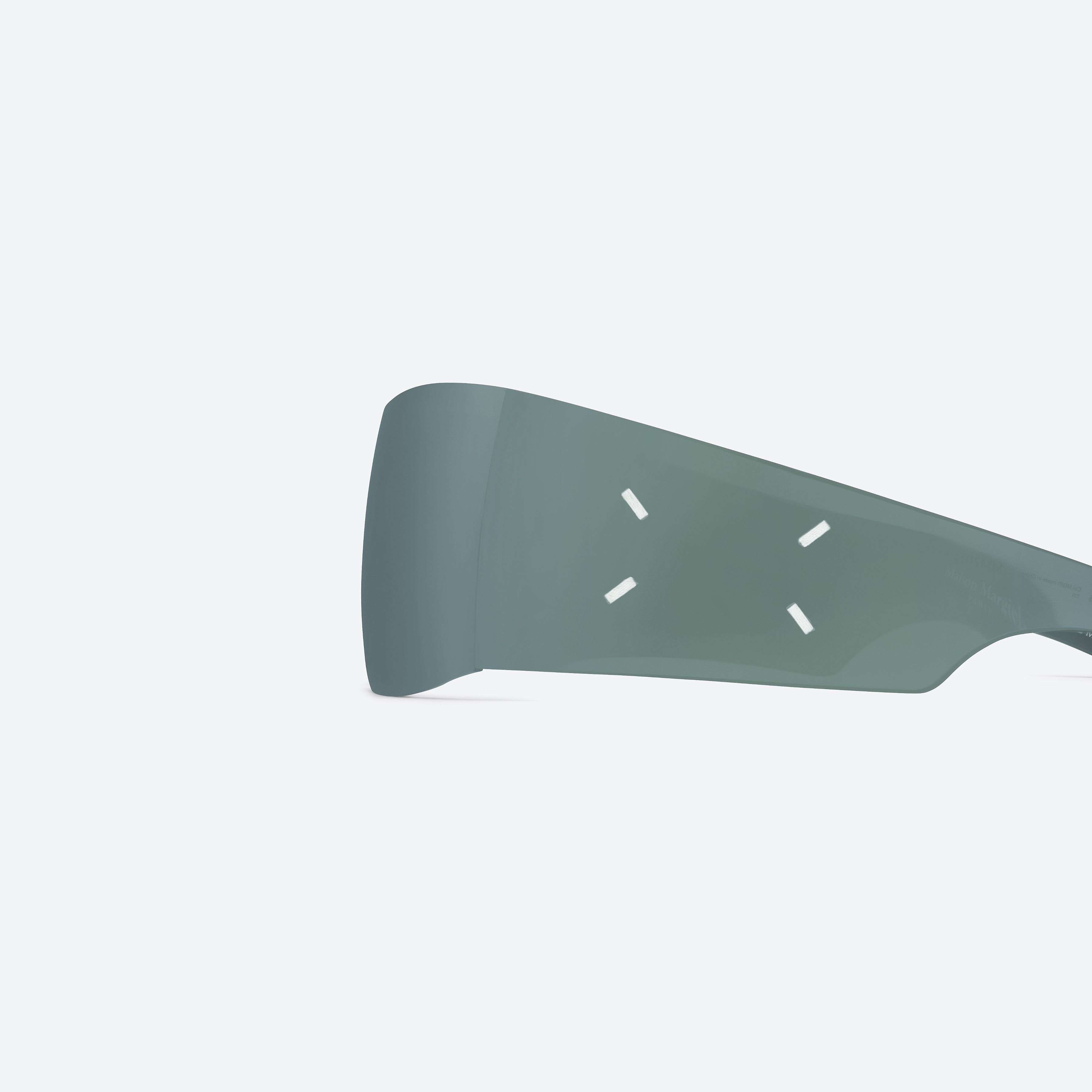 A detailed left view of Gentle Monster Maison Margiela - MM201 MGR1 Green Nylon framed Wraparound sunglasses.