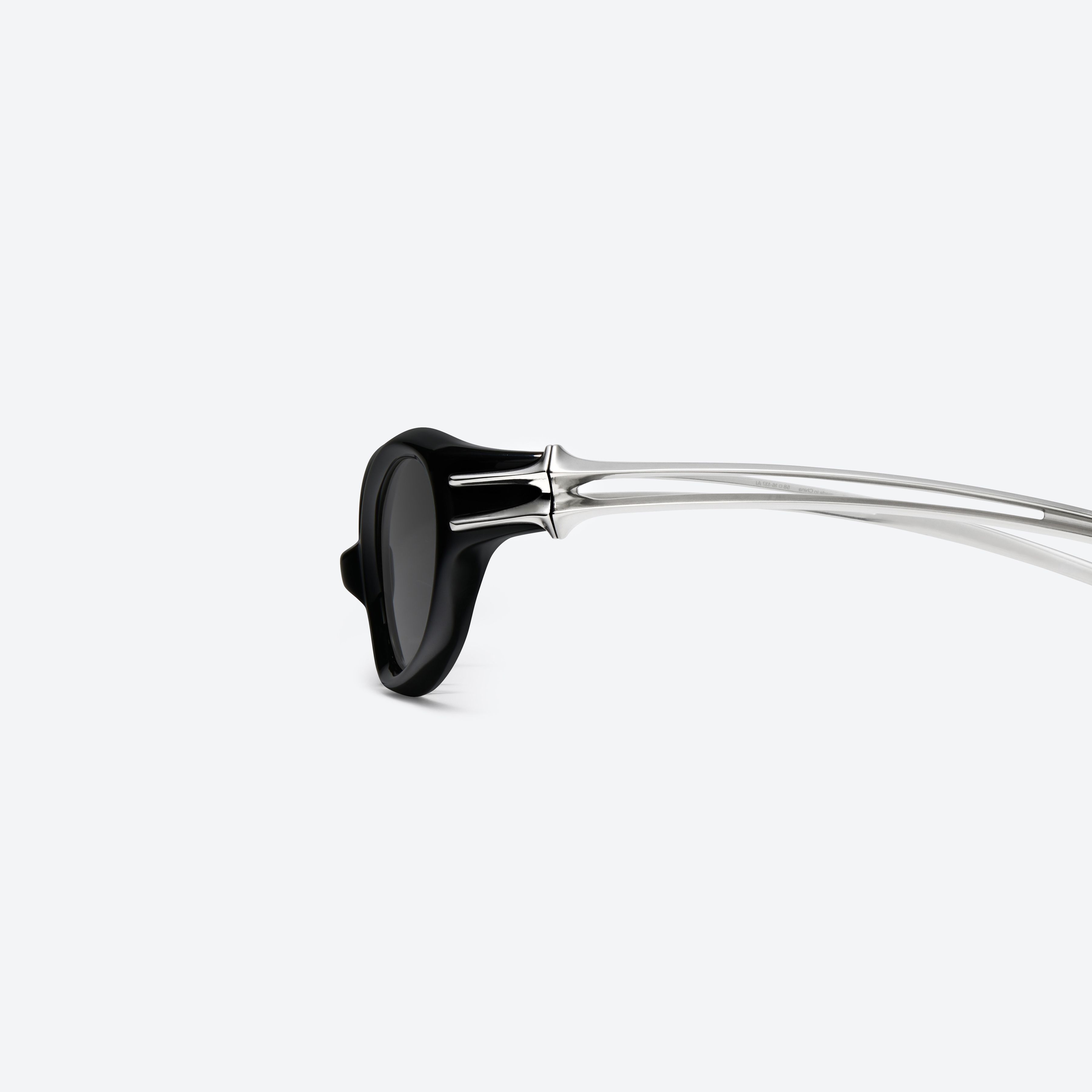A detailed left view of Gentle Monster Ximul 01 Black Mixed framed Cat-eye sunglasses.