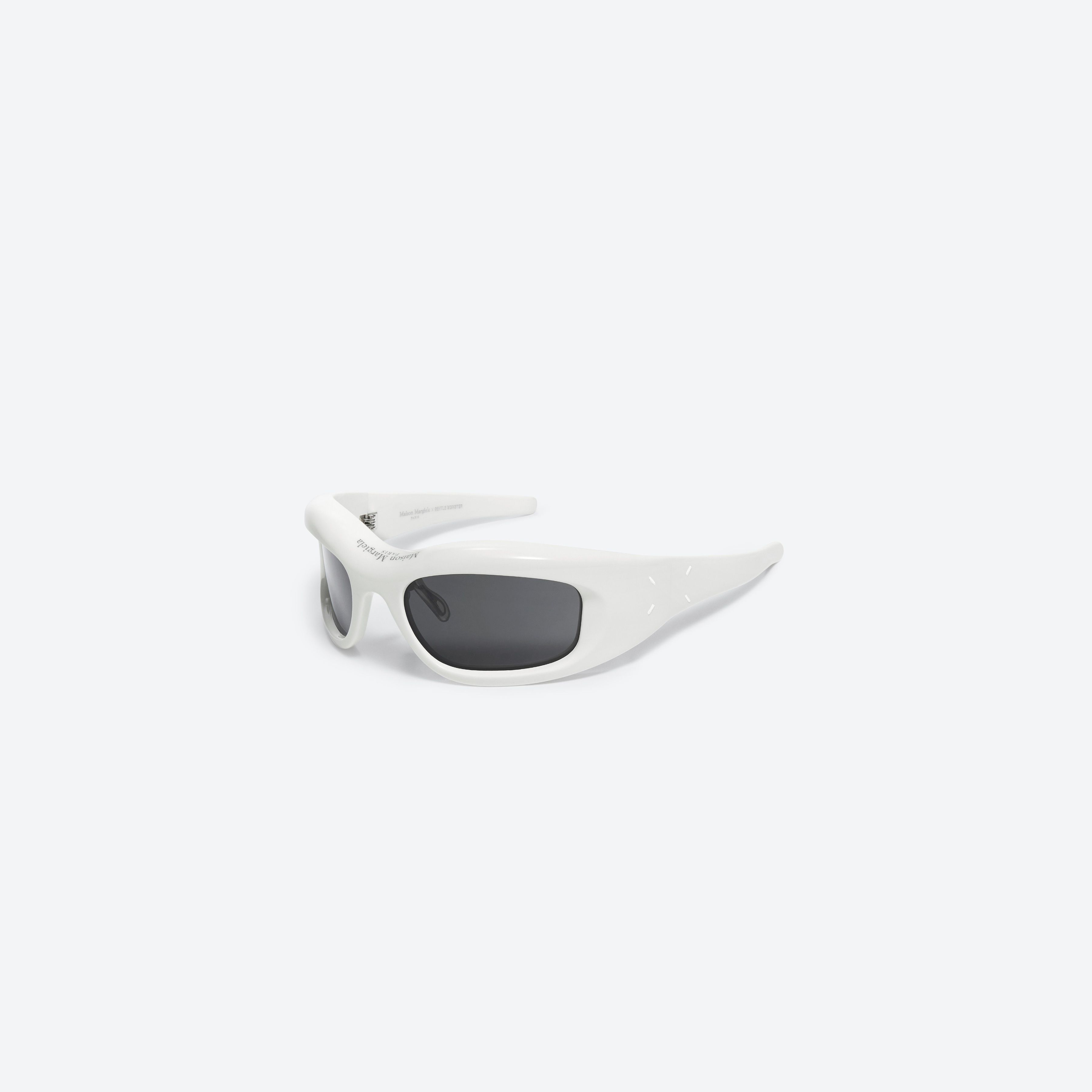 45-degree view of Gentle Monster Maison Margiela - MM002 W2 White Acetate framed Wraparound sunglasses.