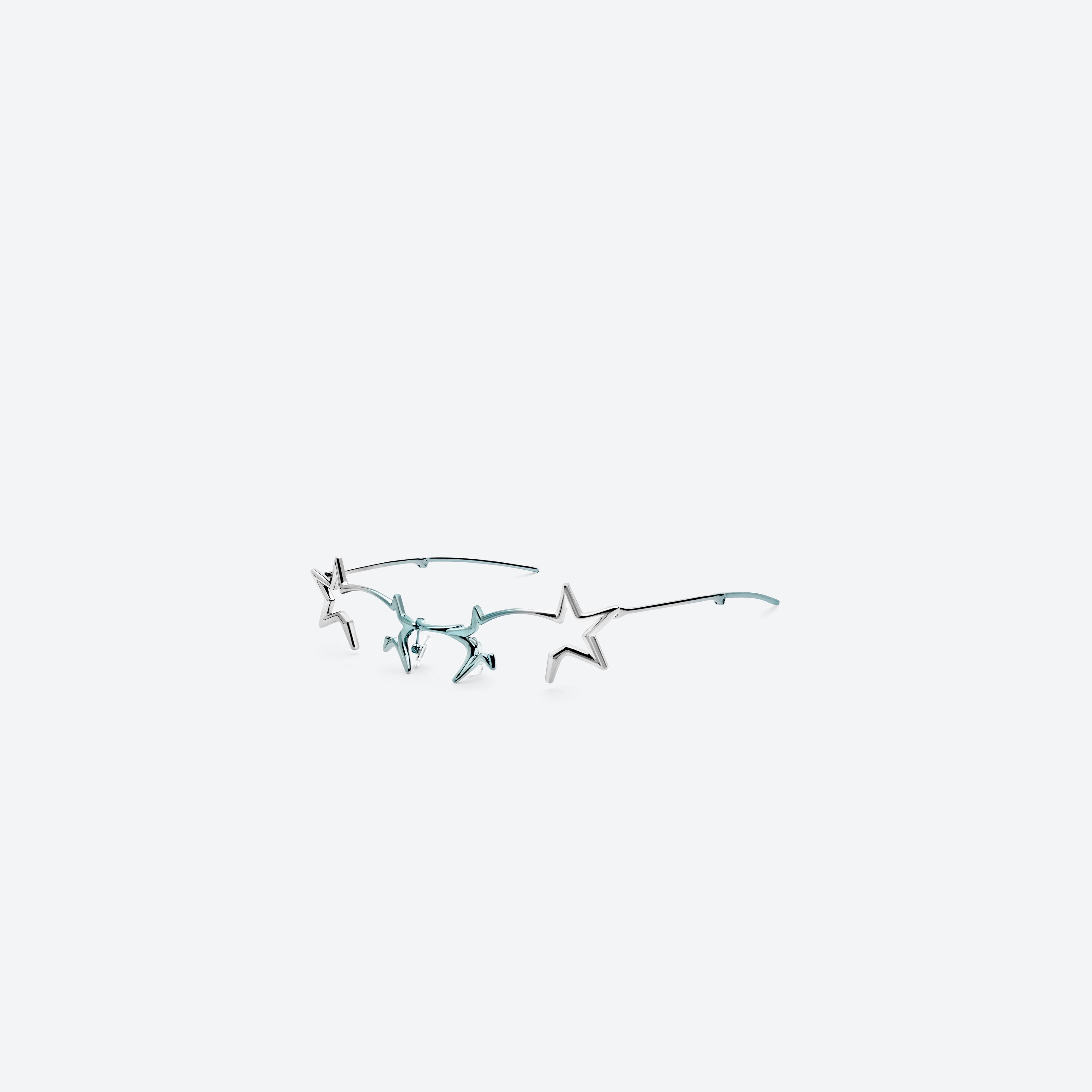 45-degree view of Gentle Monster Milky Way 02BL Similar Silver Metal framed Cat-eye glasses.