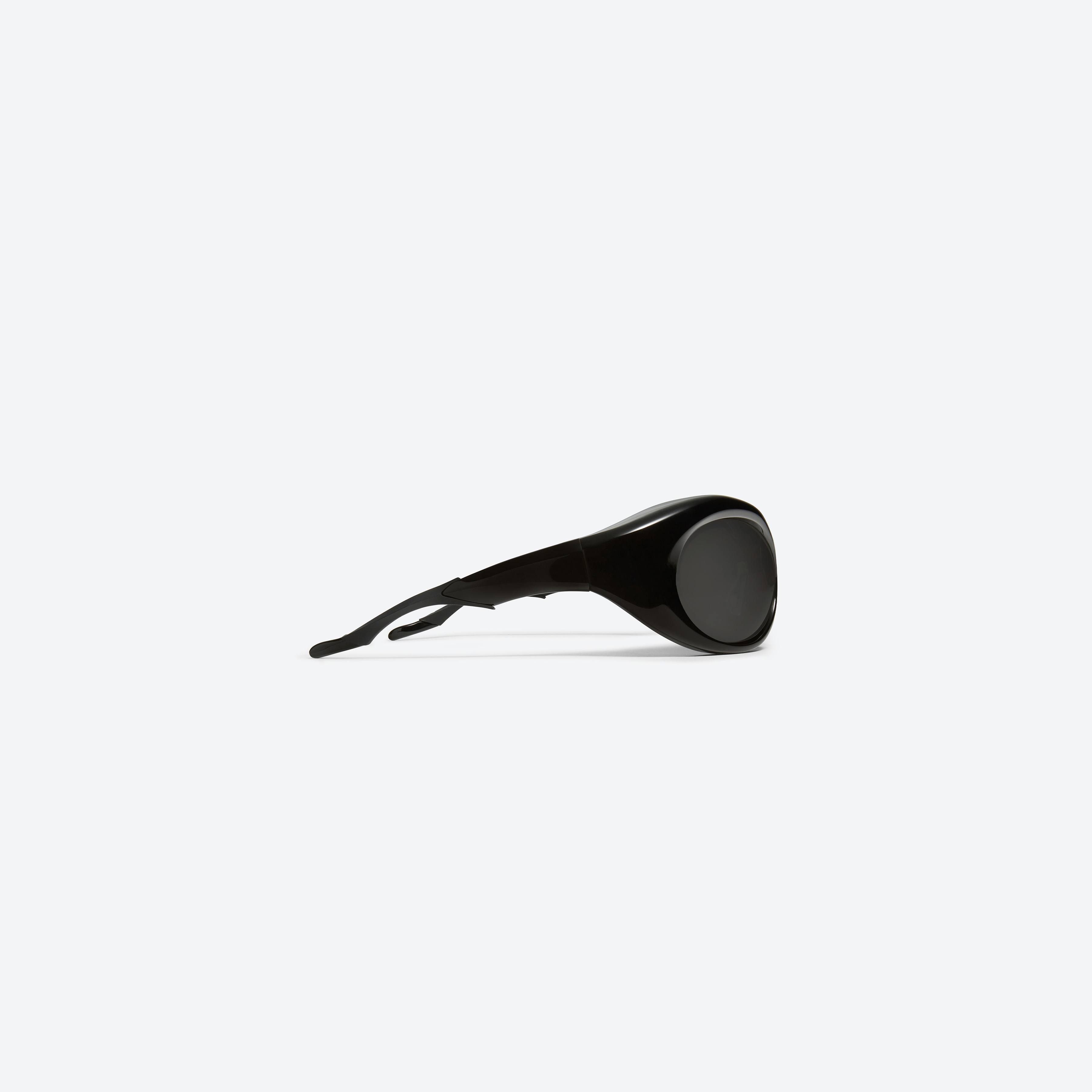 A detailed right view of Gentle Monster Maison Margiela - MM001 01 Black Acetate framed Wraparound sunglasses.