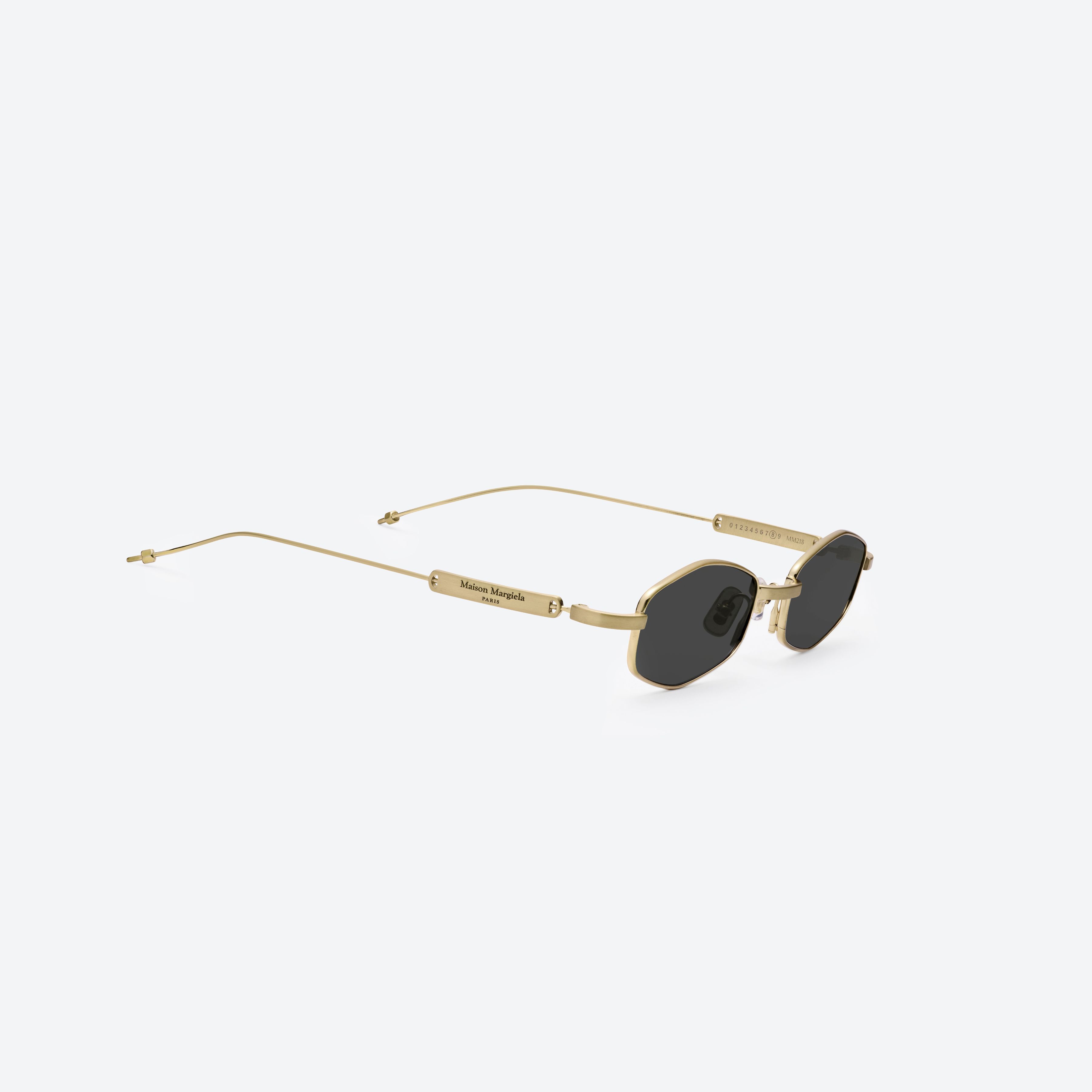 45-degree detailed view of Gentle Monster Maison Margiela - MM218 A030(G) Gold Metal framed Oval glasses.
