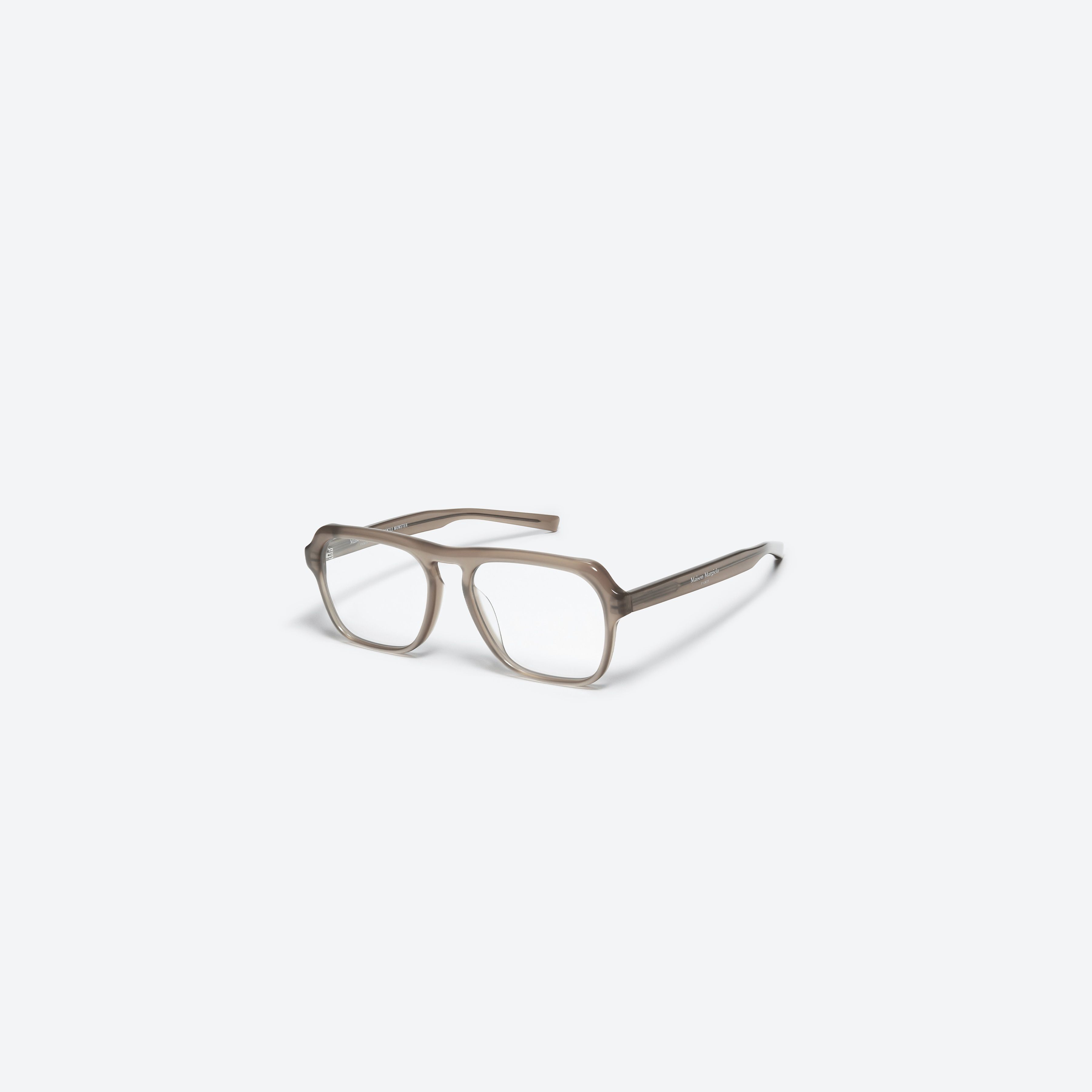 45-degree view of Gentle Monster Maison Margiela - MM011 BRC9 Brown Acetate framed Aviator glasses.