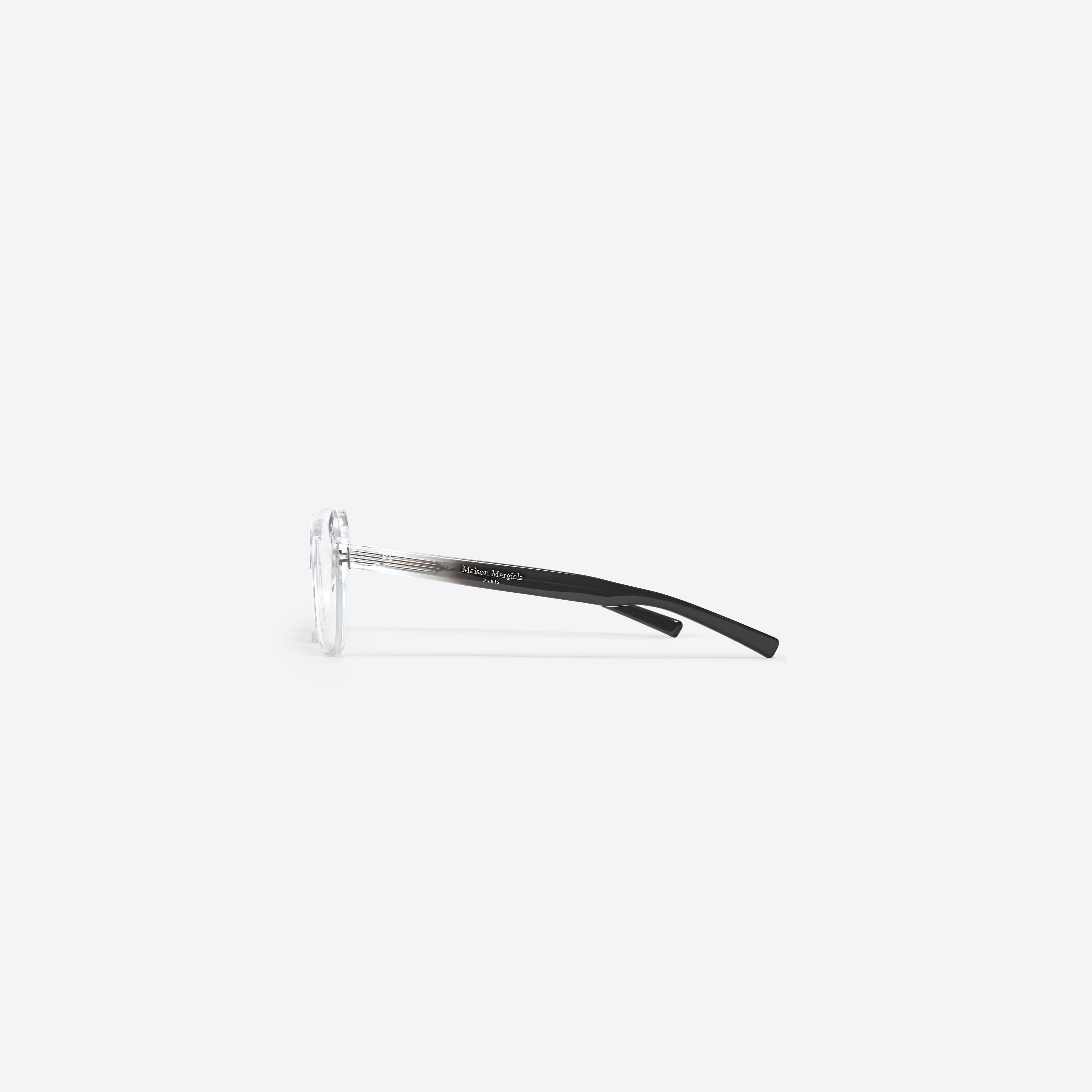 A detailed right view of Gentle Monster Maison Margiela - MM011 C1 Clear Acetate framed Aviator glasses.