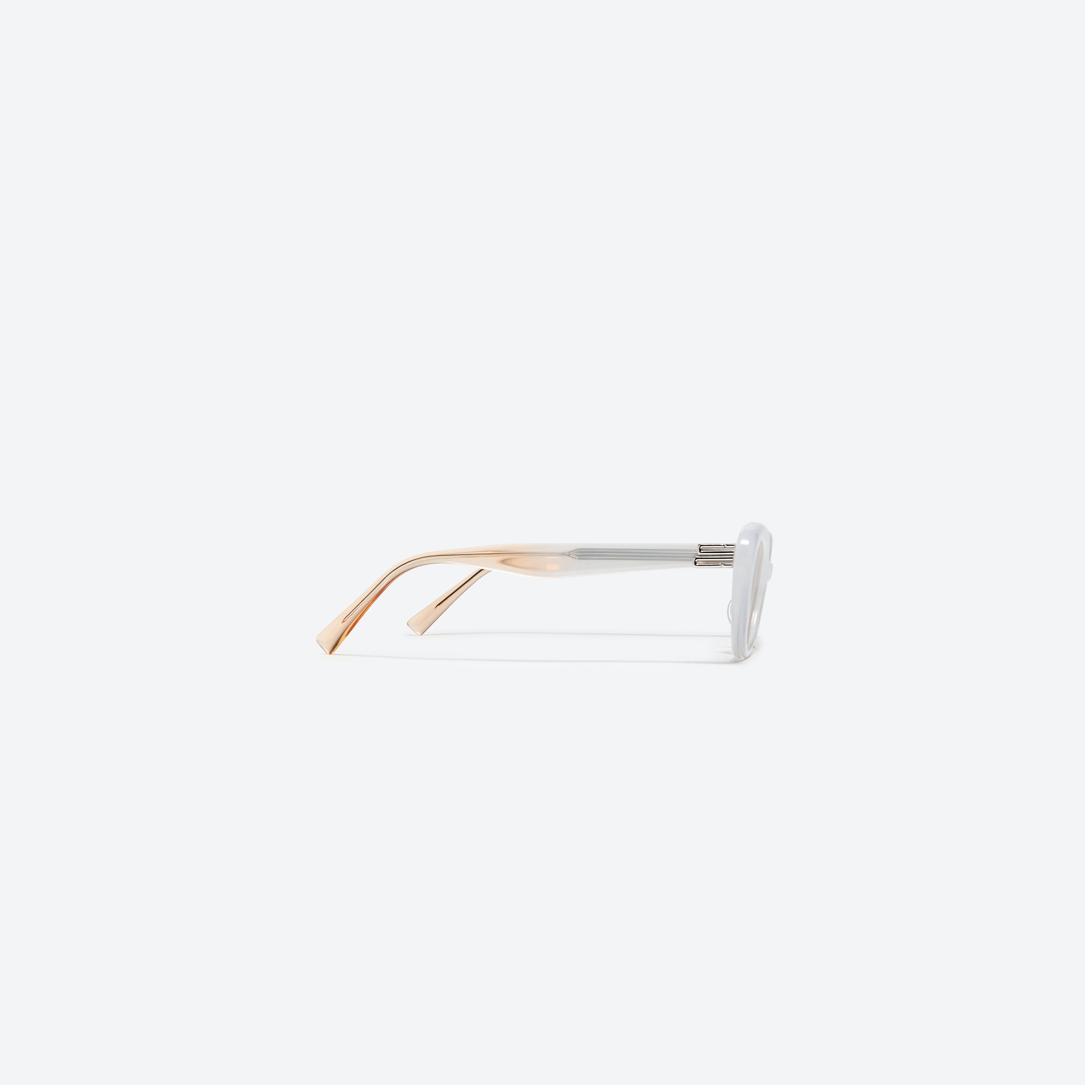 A detailed right view of Gentle Monster Mondri WC5 White Acetate framed Cat-eye sunglasses.
