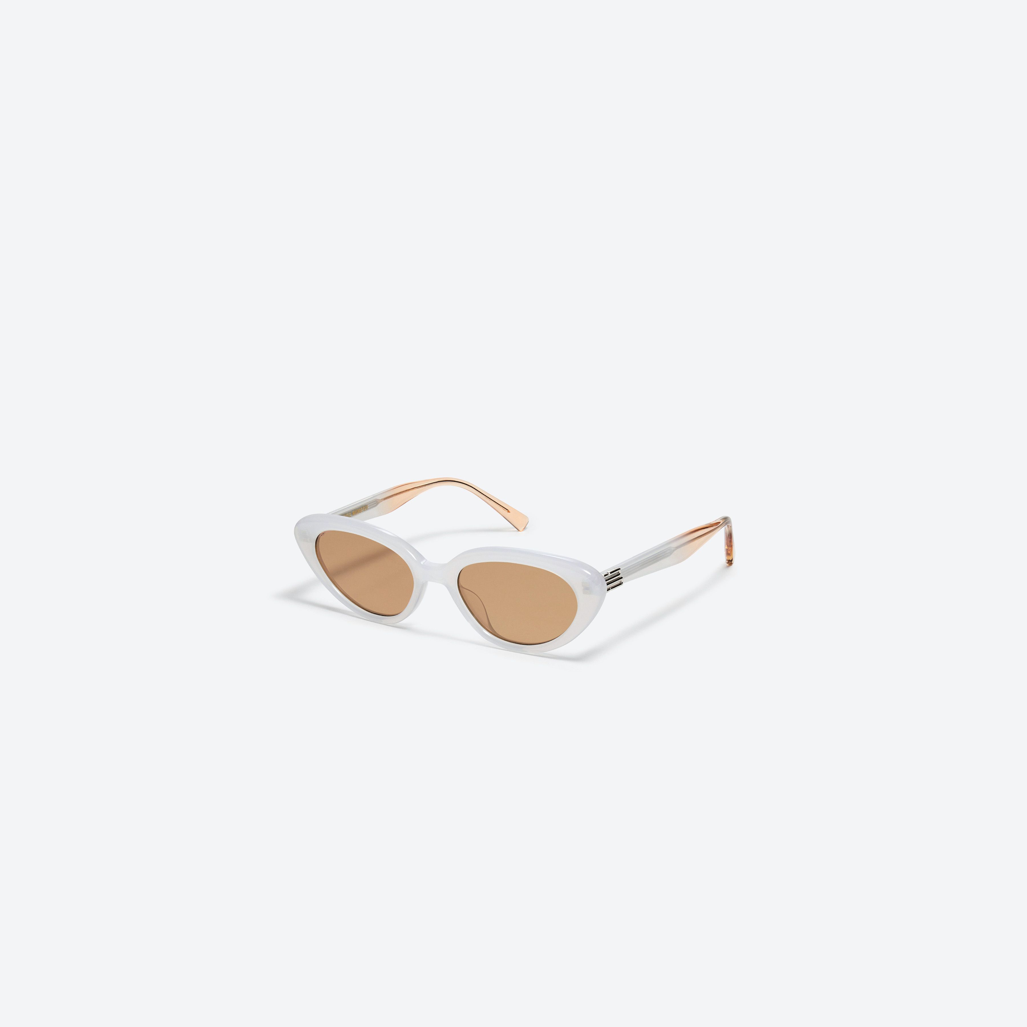 45-degree view of Gentle Monster Mondri WC5 White Acetate framed Cat-eye sunglasses.