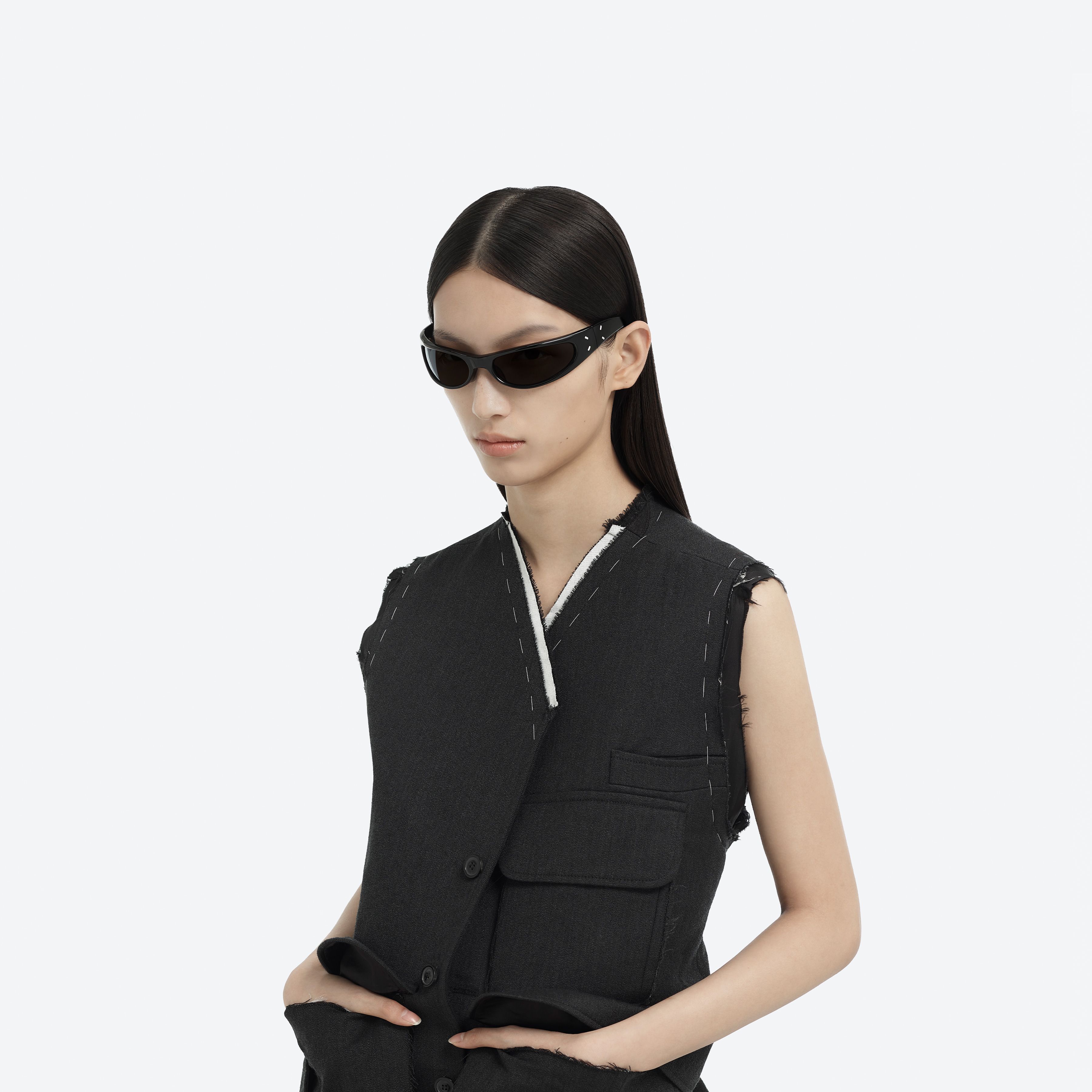 Model wearing the MM203 01 Black Acetate framed Wraparound sunglasses.