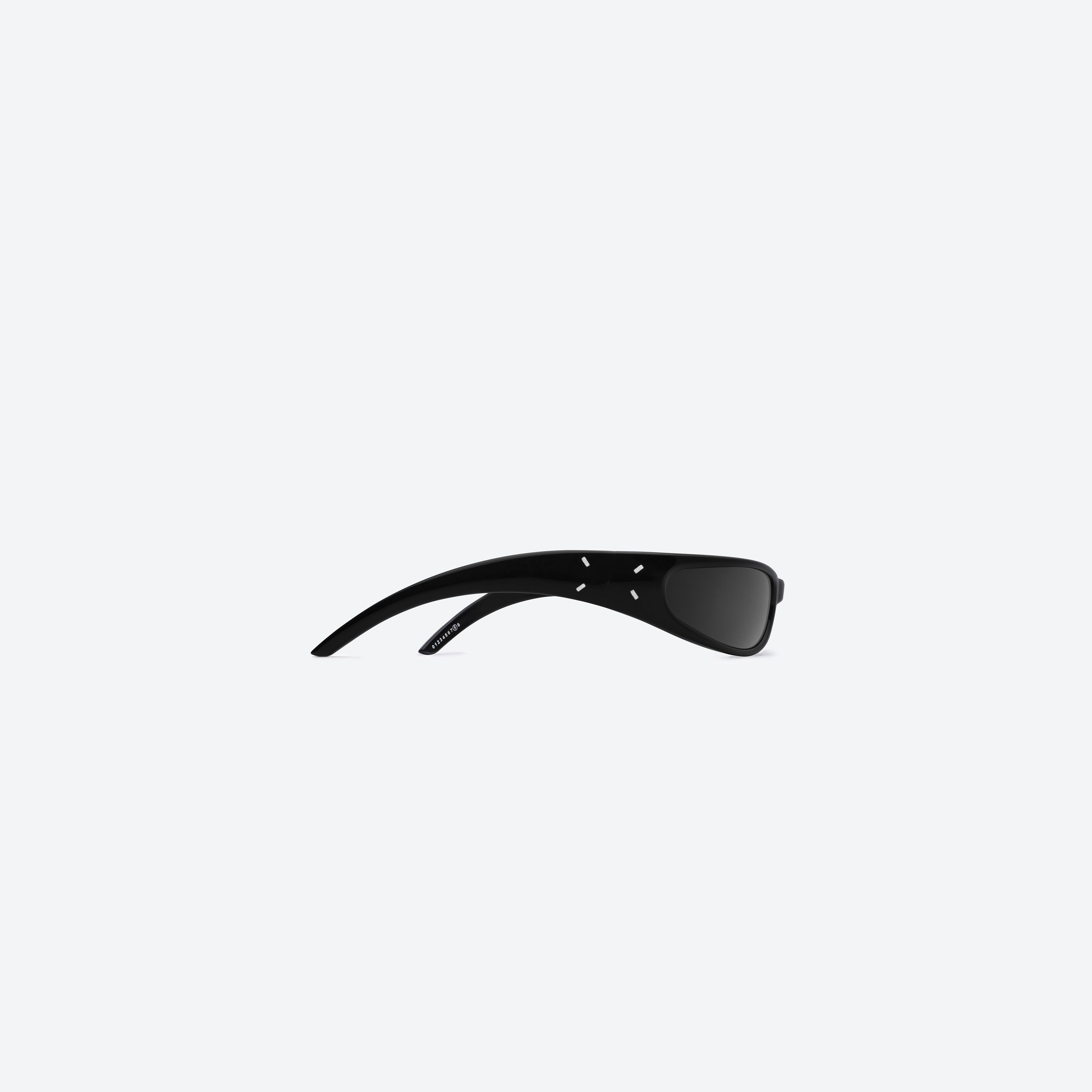 A detailed right view of Gentle Monster MM203 01 Black Acetate framed Wraparound sunglasses.