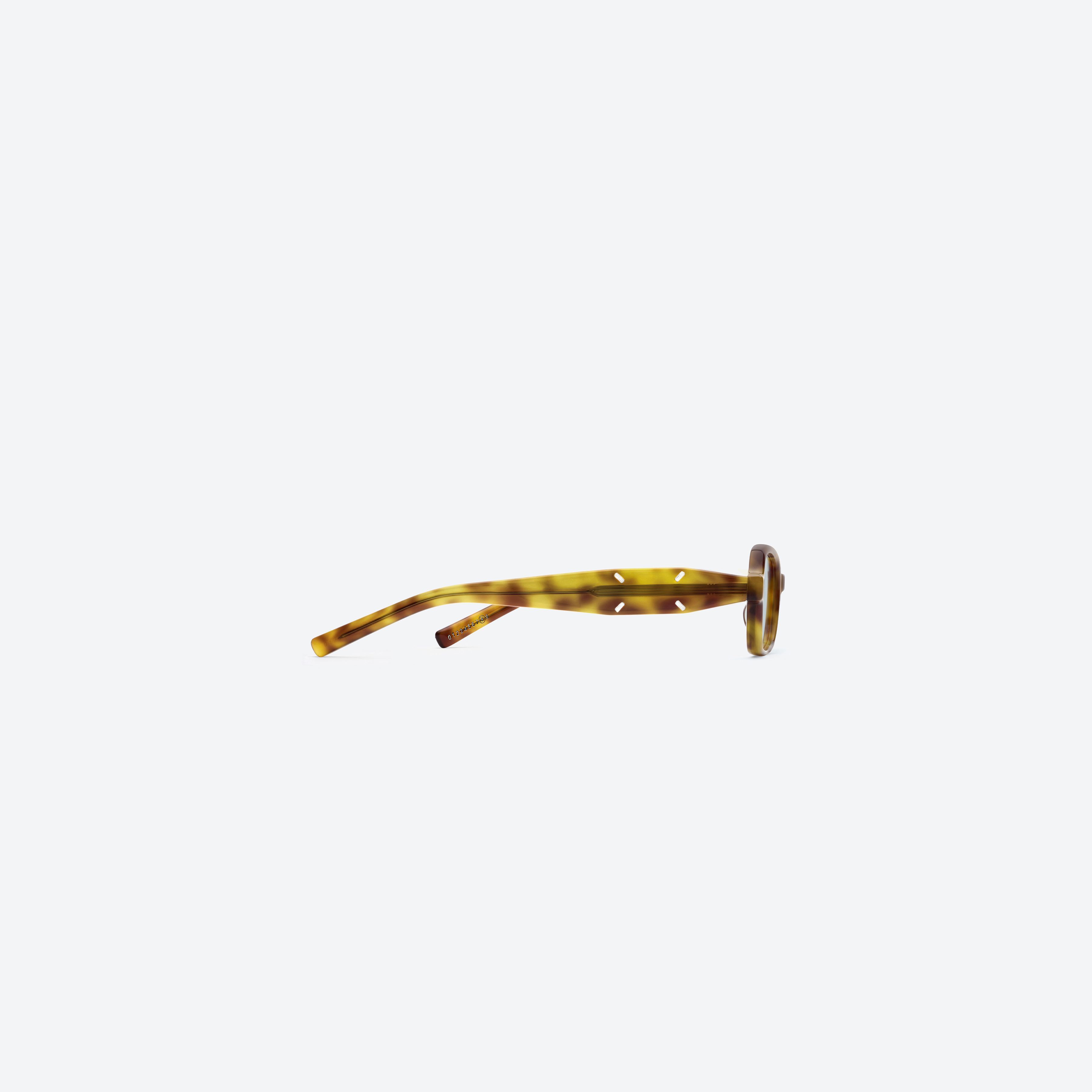 A detailed right view of Gentle Monster Maison Margiela - MM210 T6(GR) Tortoise Acetate framed Square glasses.