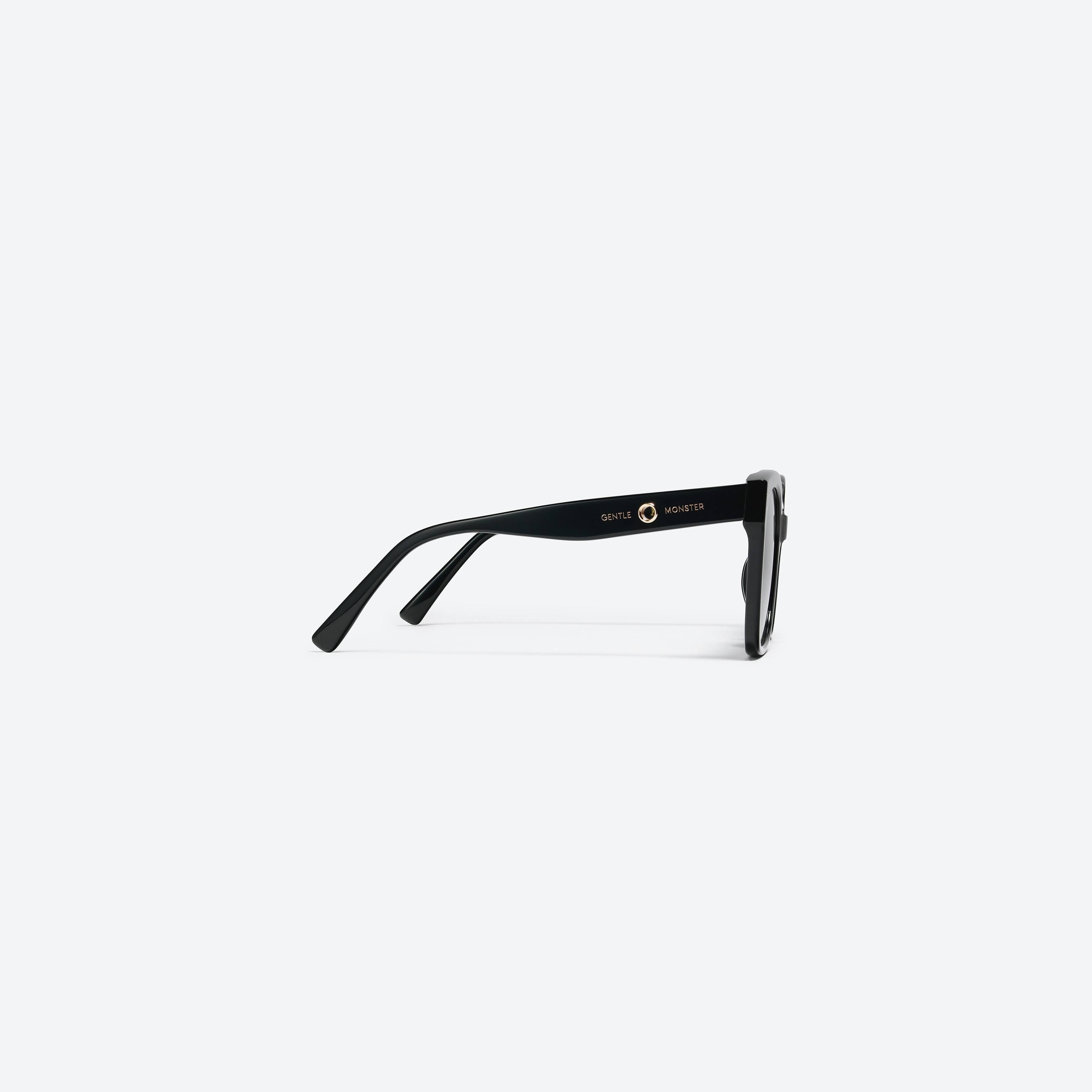 A detailed right view of Gentle Monster Jennie - Kuku 01 Black Acetate framed Square sunglasses.