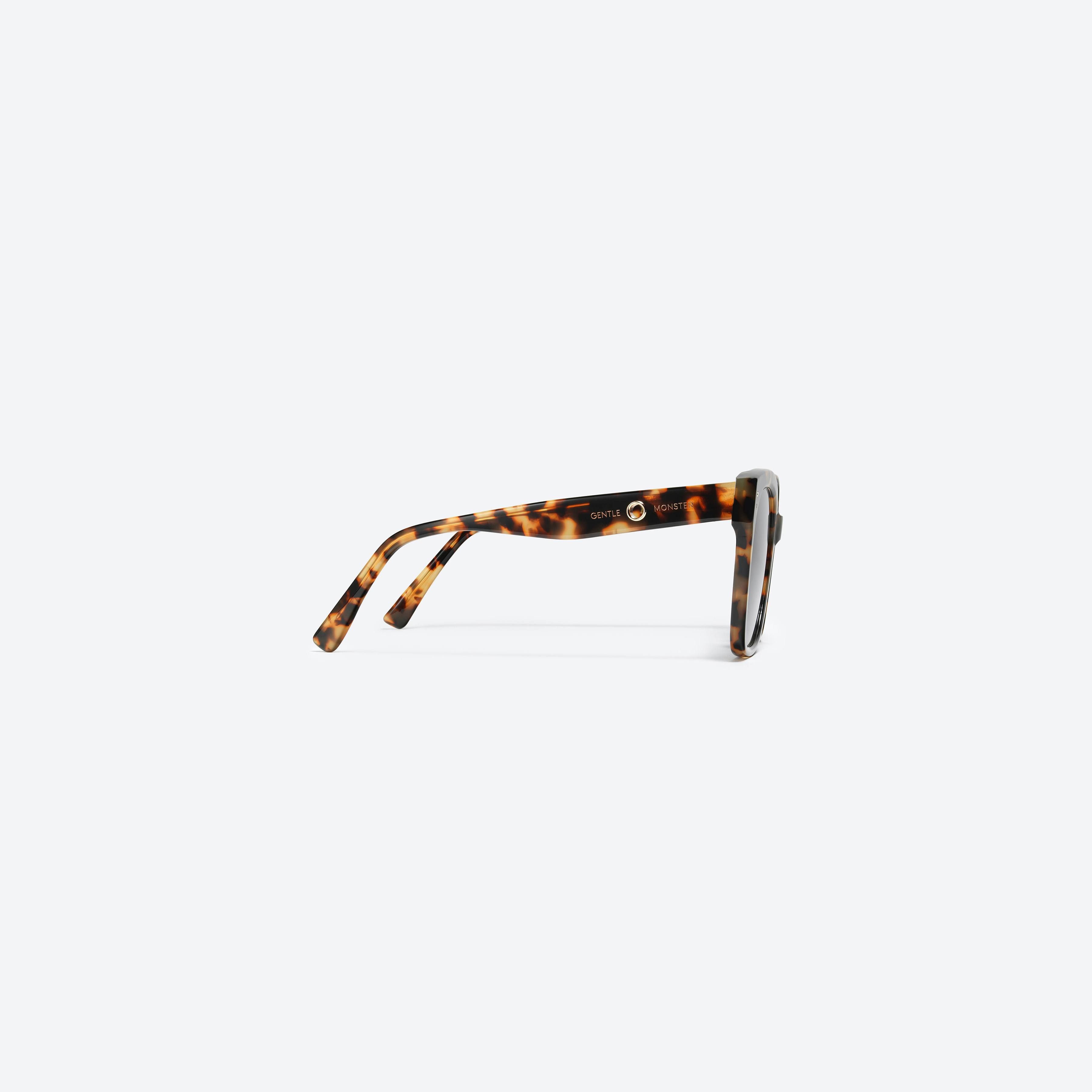 A detailed right view of Gentle Monster Jennie - Kuku 034 Tortoise Acetate framed Square sunglasses.