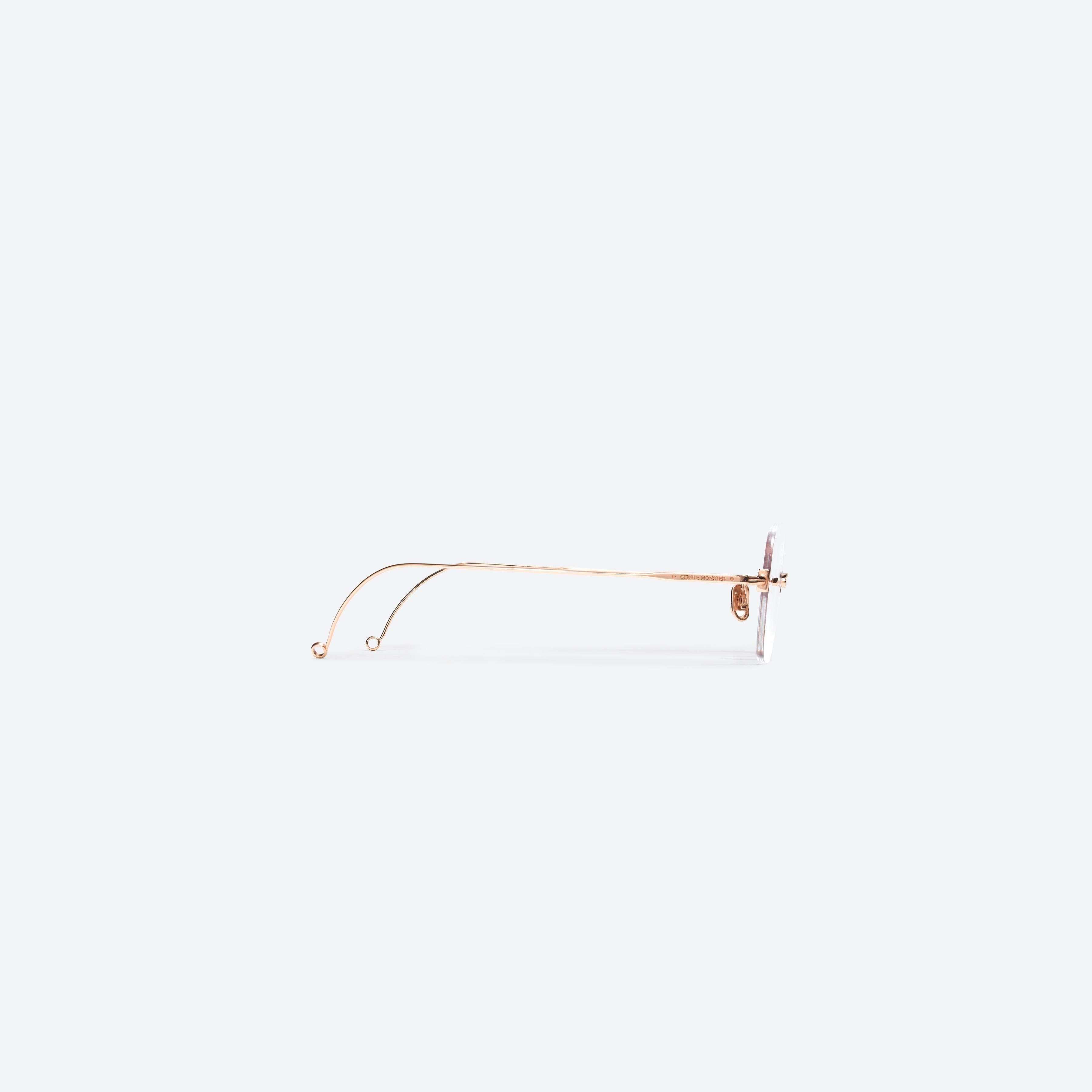 A detailed right view of Gentle Monster Jennie - Daisy 032 Gold Metal framed Square glasses.