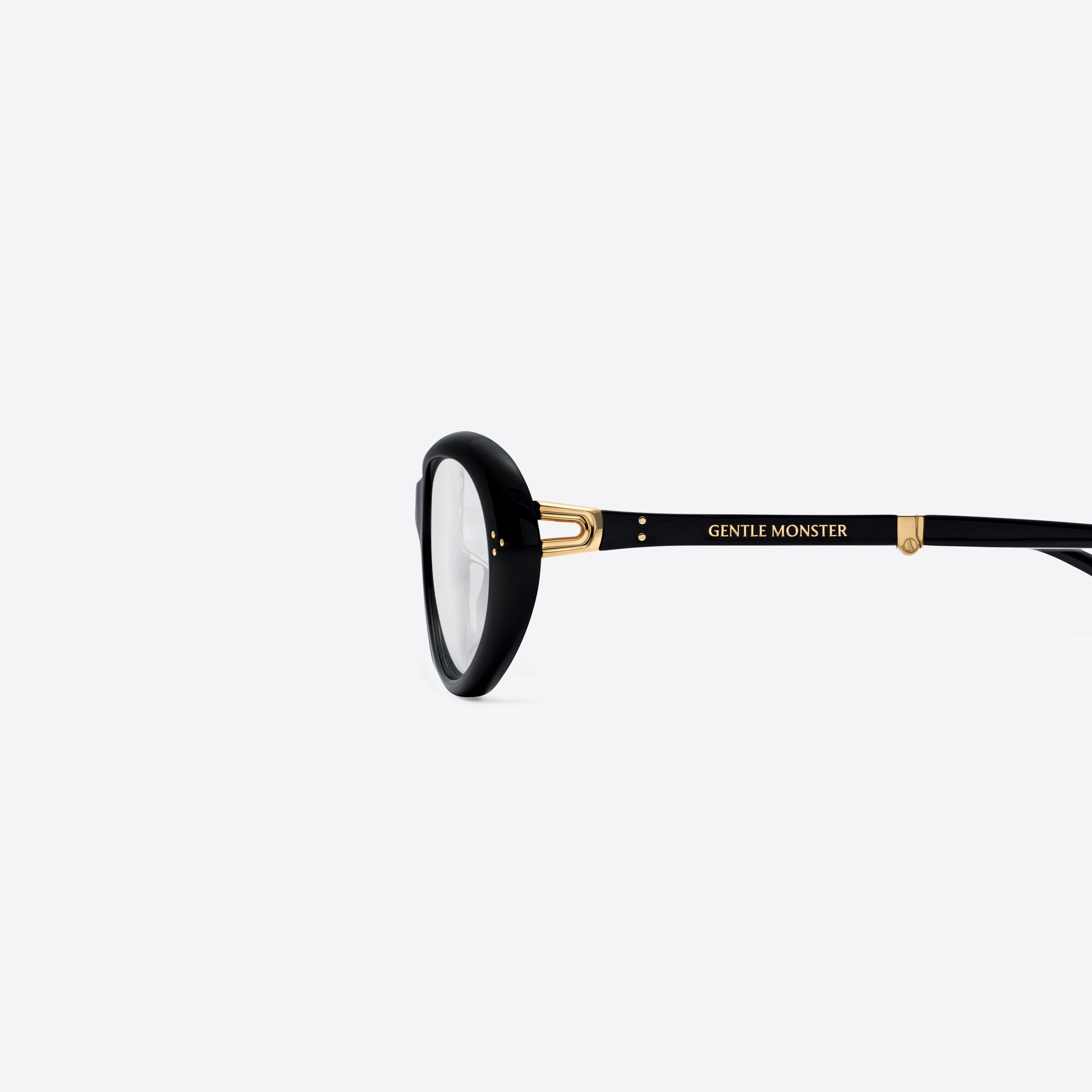A detailed left view of Gentle Monster Orbit 01 Black Acetate framed Round glasses.