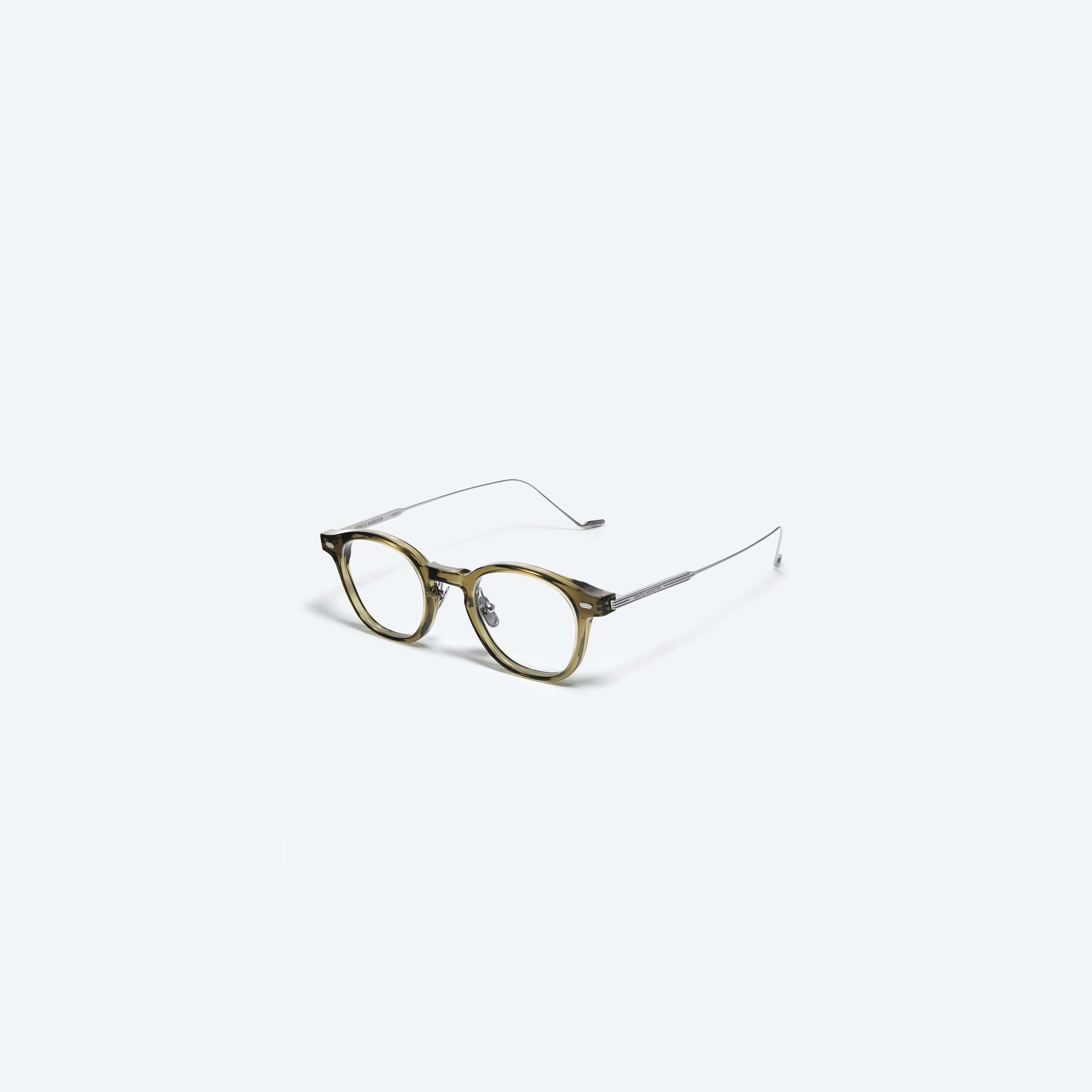 45-degree view of Gentle Monster Eddy KC1 Green Mixed framed Square glasses.