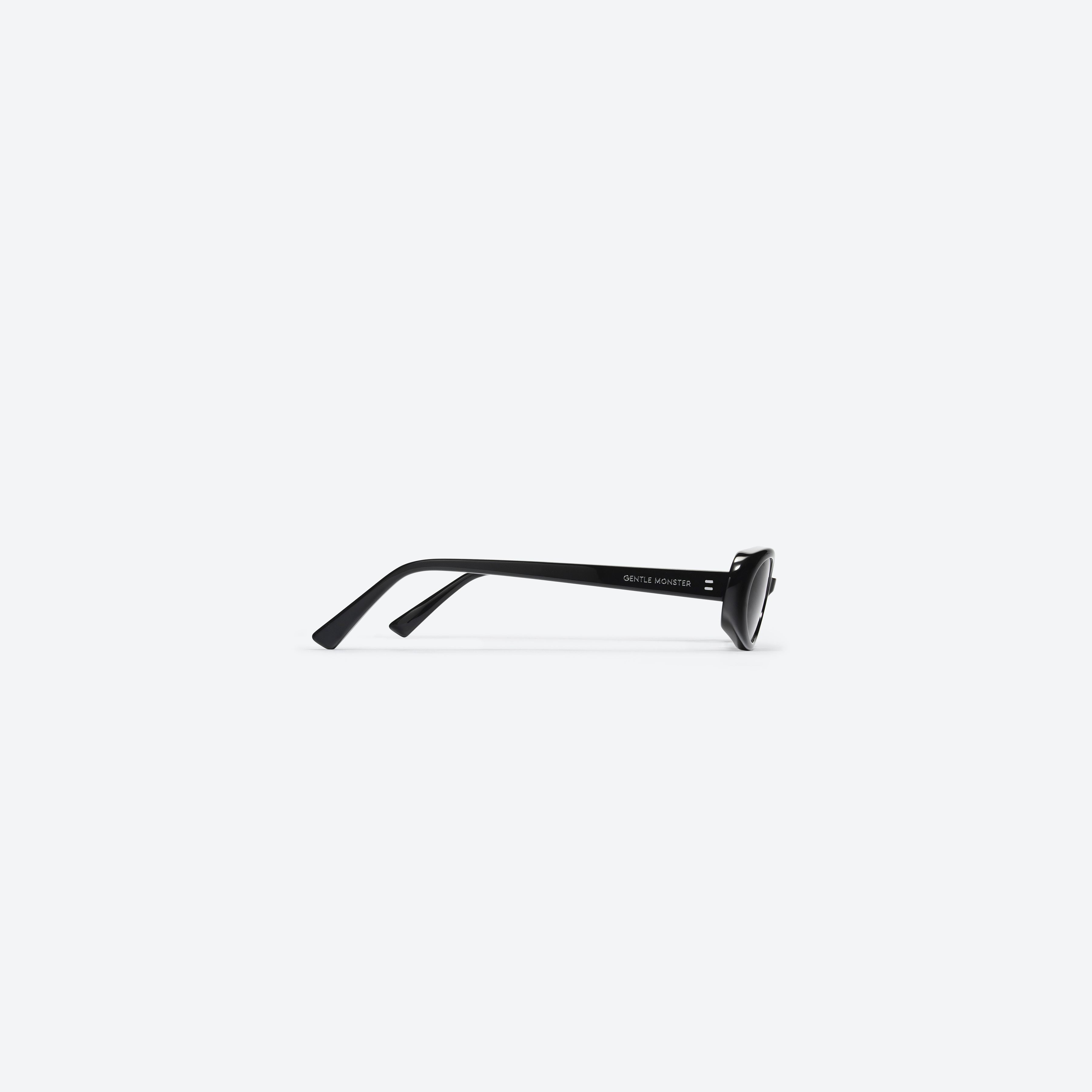 A detailed right view of Gentle Monster Dua 01 Black Acetate framed Oval sunglasses.
