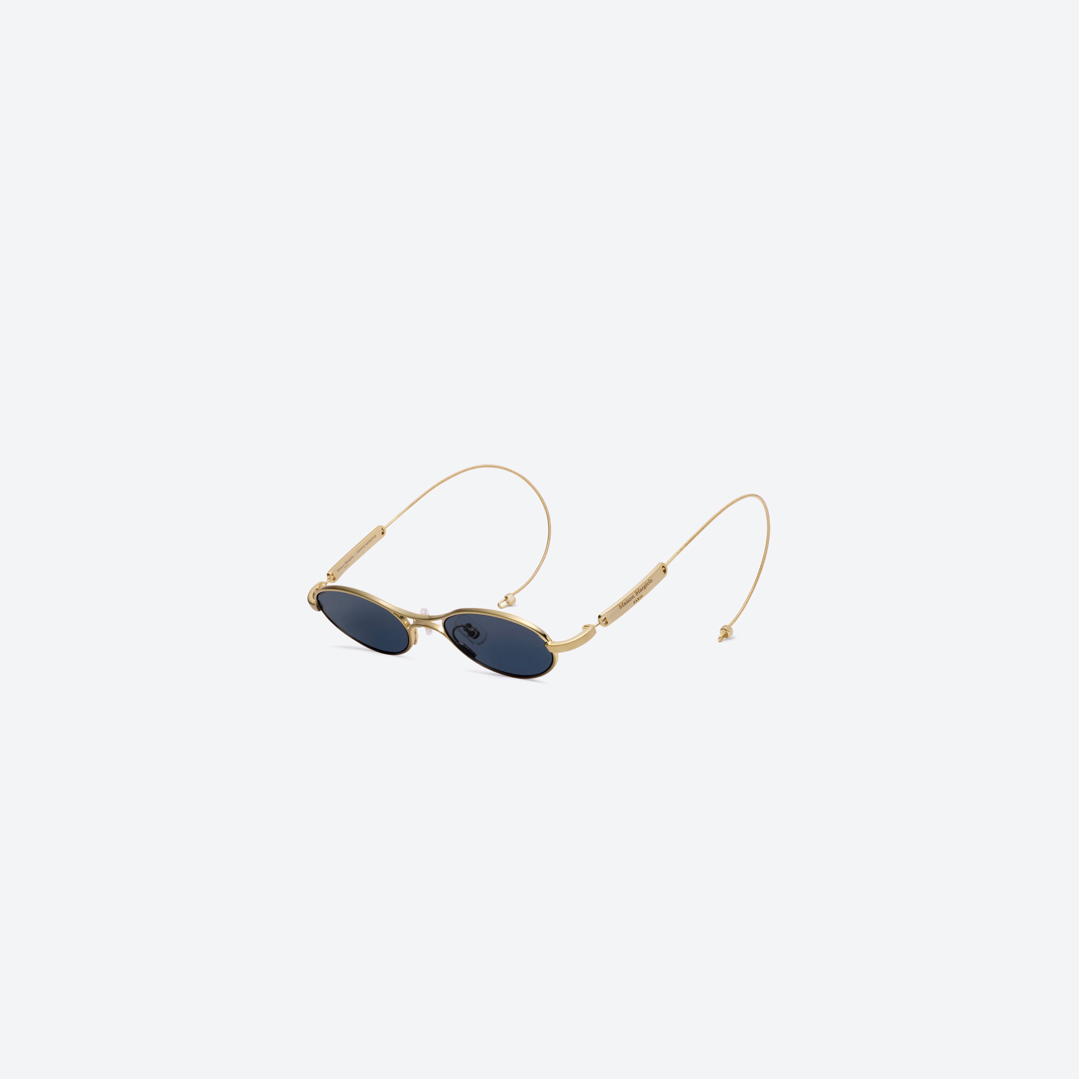 A detailed right view of Gentle Monster MM220 A030(N) Gold Metal framed Oval glasses.