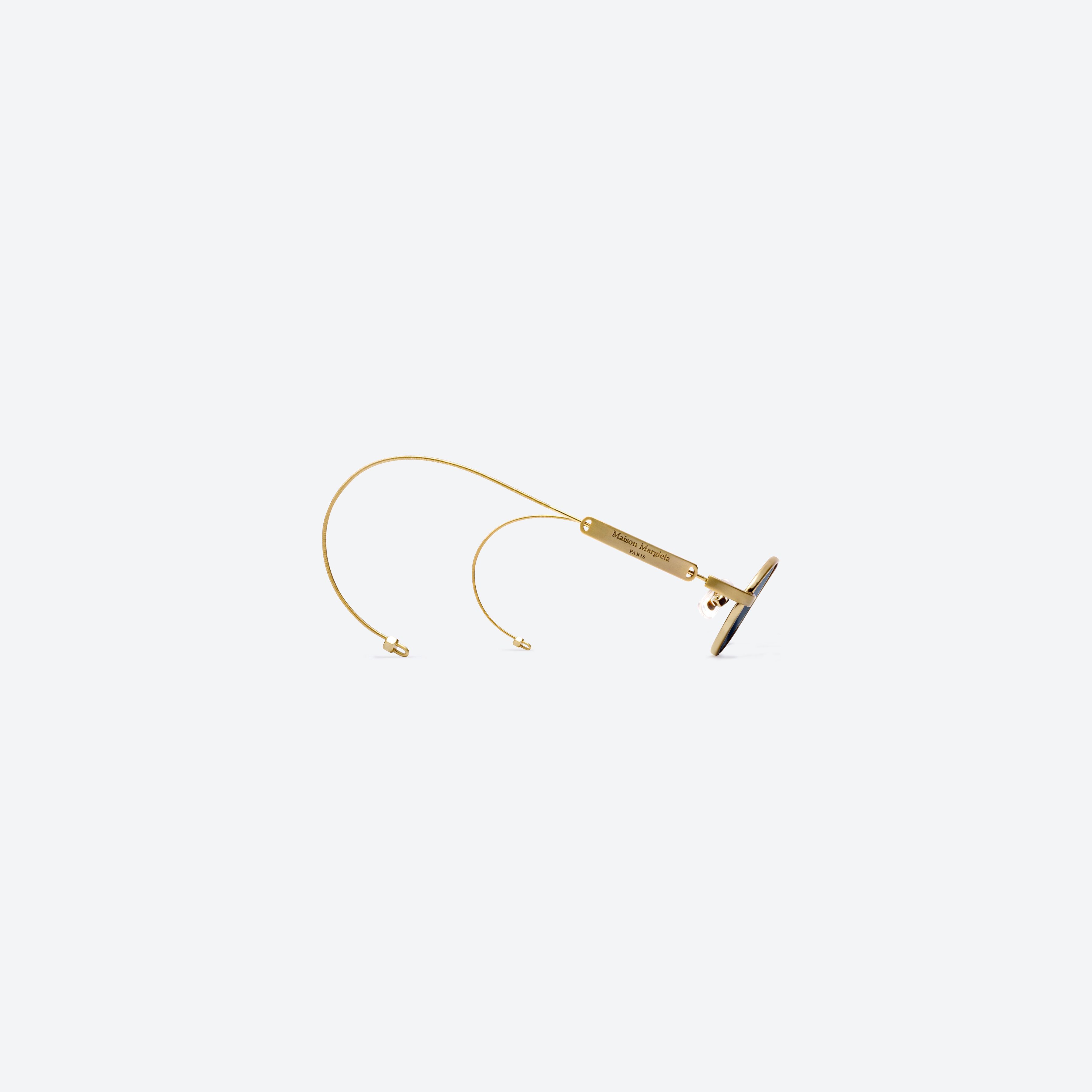 45-degree detailed view of Gentle Monster MM220 A030(N) Gold Metal framed Oval glasses.