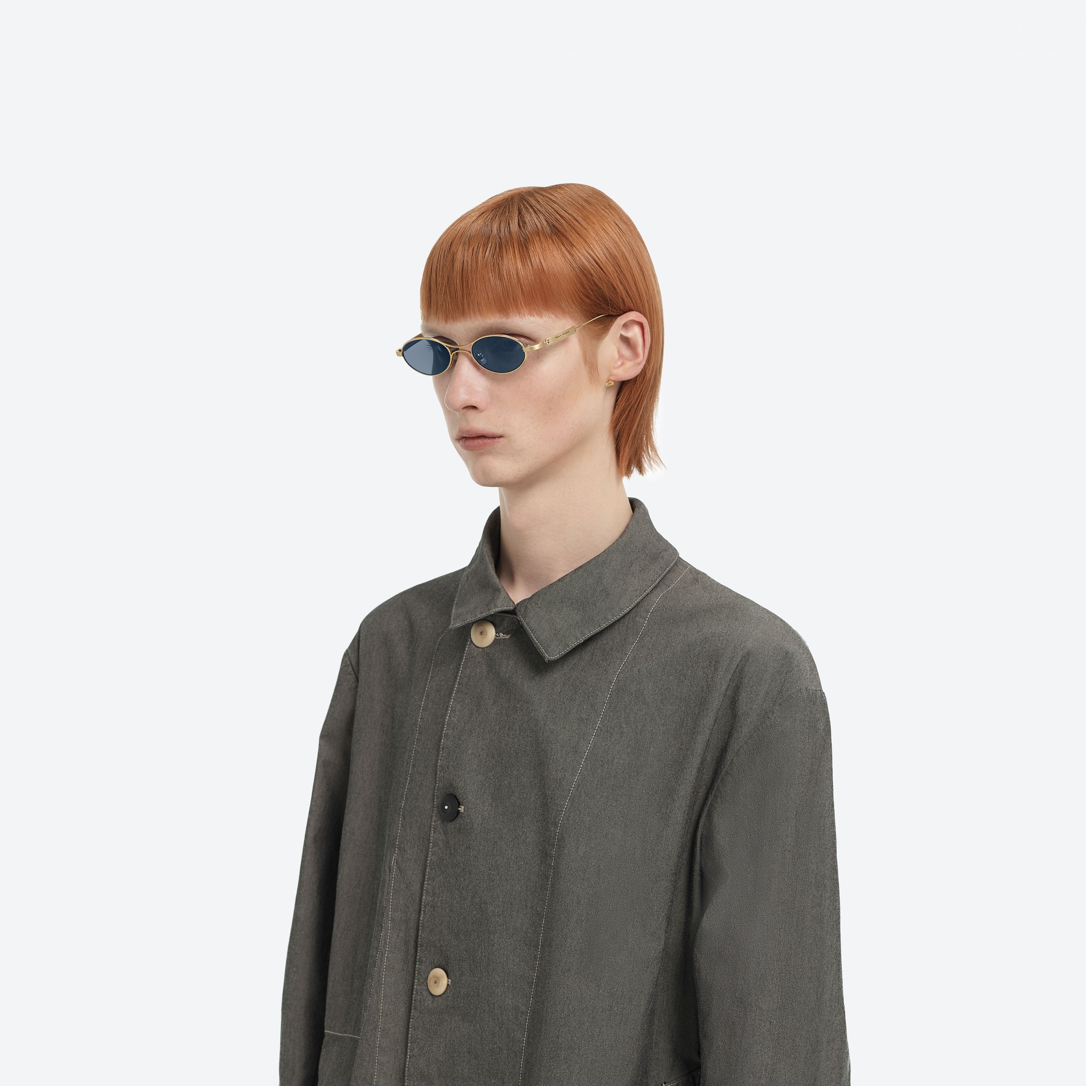 Model wearing the MM220 A030(N) Gold Metal framed Oval glasses.